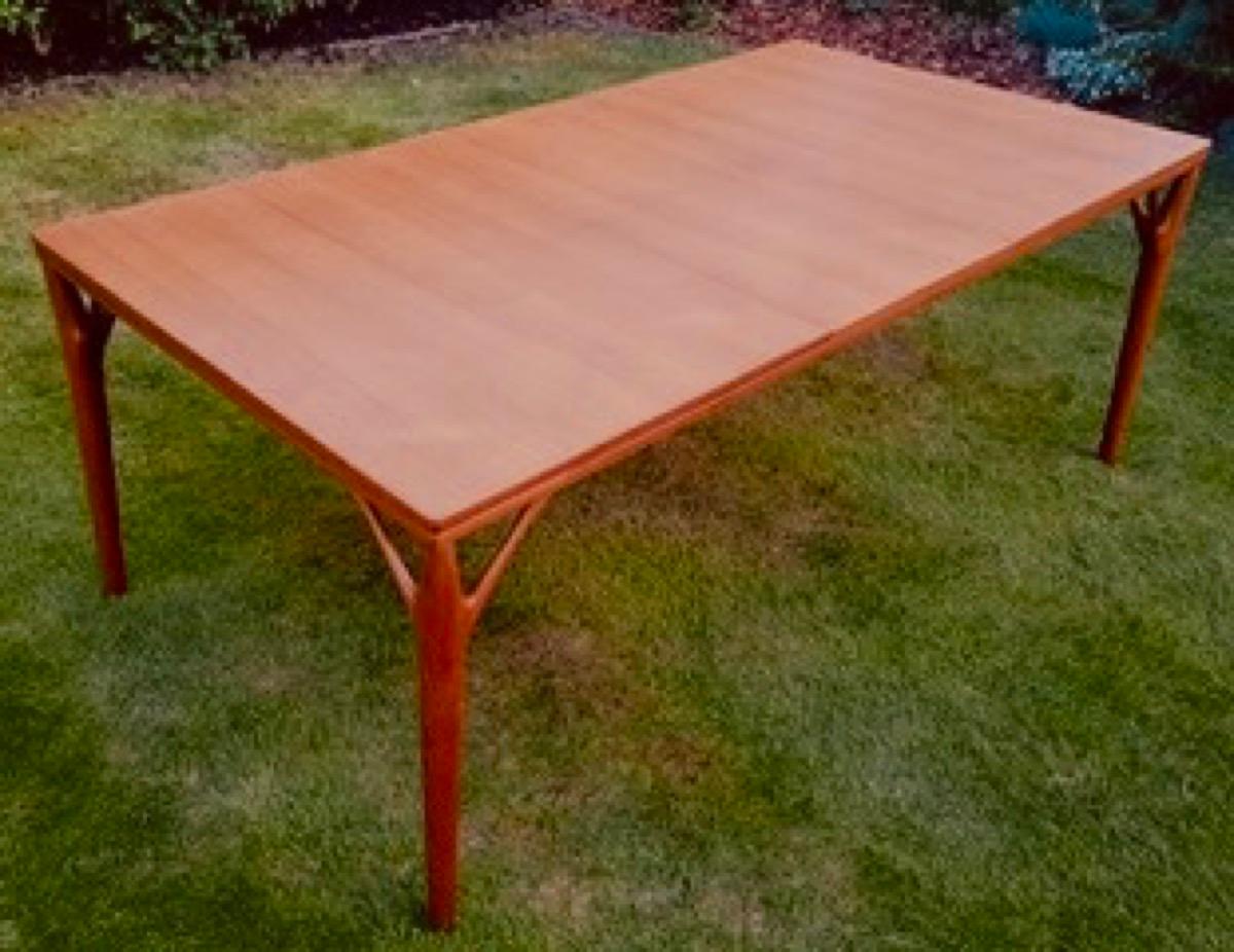 An incredible and rare to source 1960s 'Tree Leg' extendable teak dining table designed by Willy Sigh’s and manufactured by his own company - H. Sigh & Søn. Model 180. The original manufacturer's makers label is still present on the underside of the