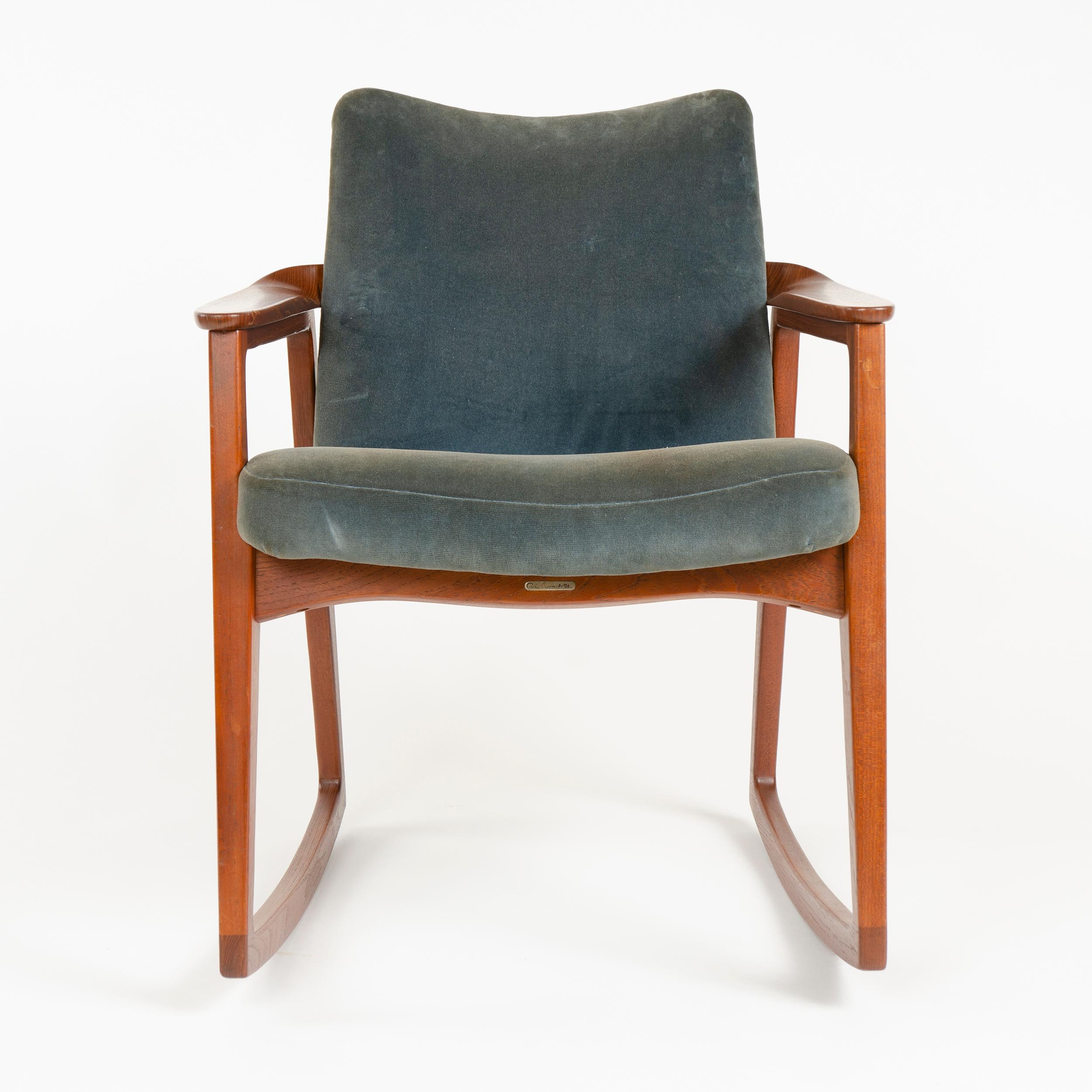 Solid teak, upholstered rocking chair in vintage velvet fabric.
 