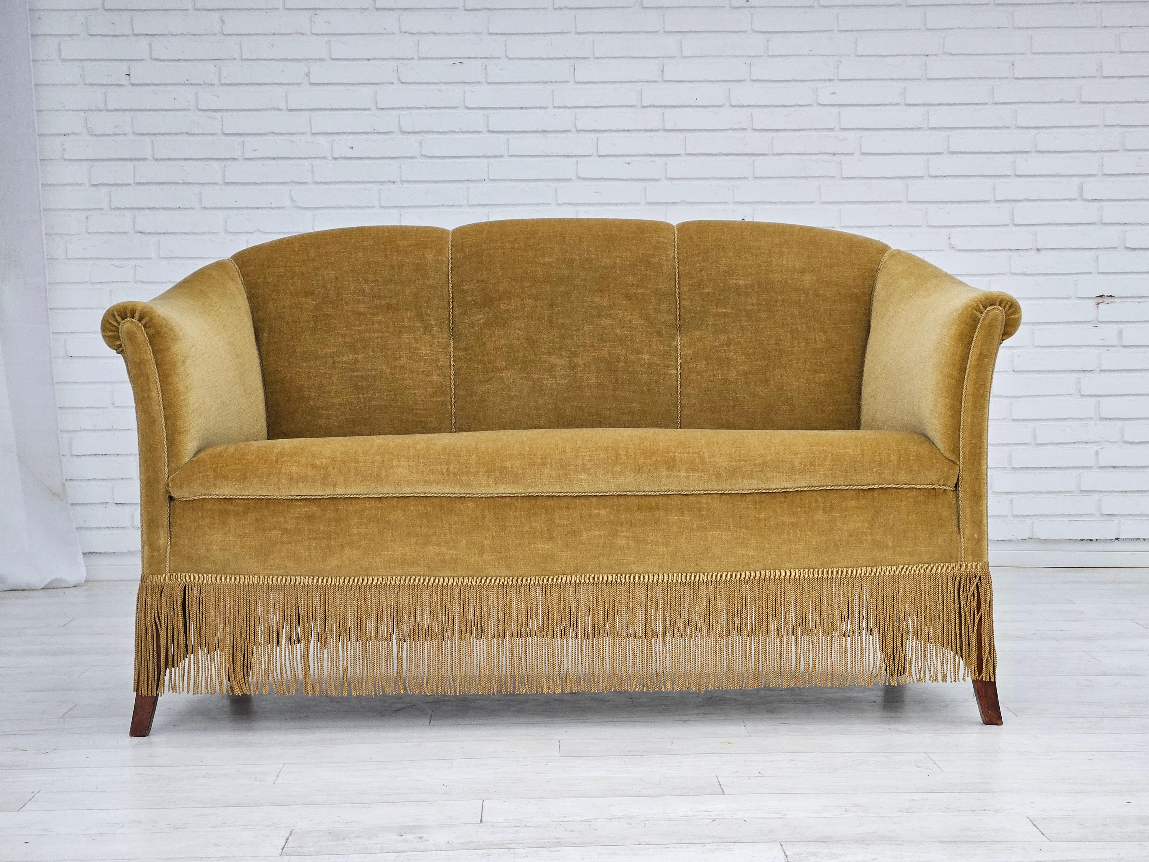 1960s, Danish 2 seater sofa in original very good condition: no smells and no stains. Green/yellow velour, beech wood legs. Springs in the seat. Manufactured by Danish furniture manufacturer in about 1955s.
