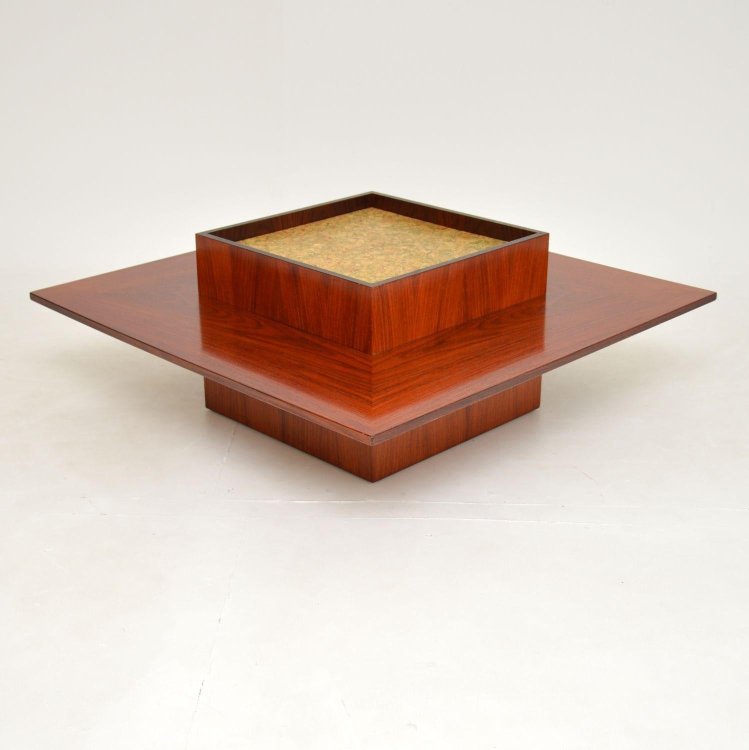 An excellent and very impressive Danish vintage coffee table. This was made in Denmark by Mobelintarsia, it dates from around the 1960-1970’s.

The quality is fantastic and this is a great size. It is large and square, with a very interesting