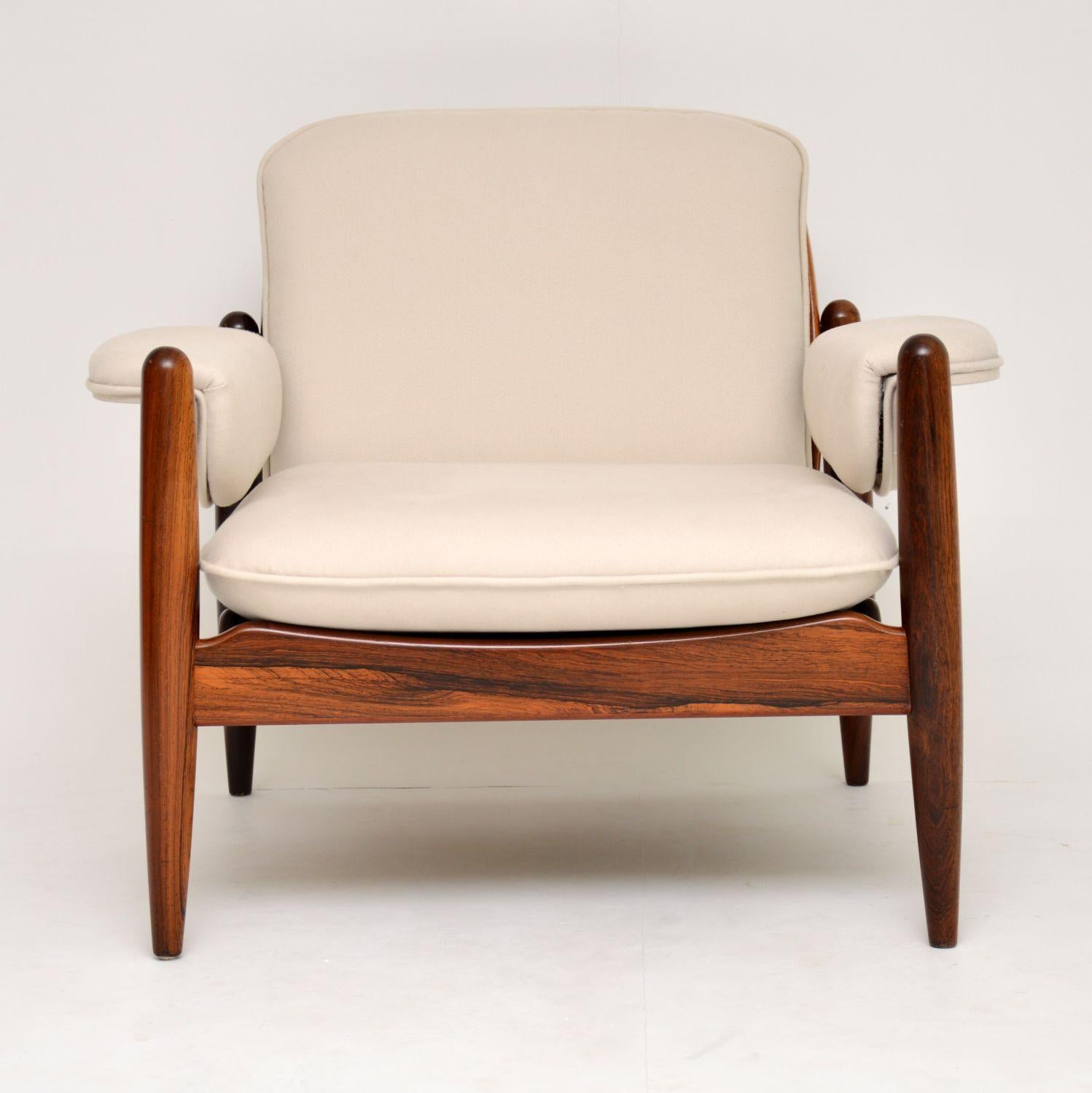 A stunning and extremely well made armchair, this was made in Denmark, it dates from the 1960s. It’s of outstanding quality, it’s sturdy and very comfortable, with beautiful wood grain patterns throughout. The design is particularly striking from