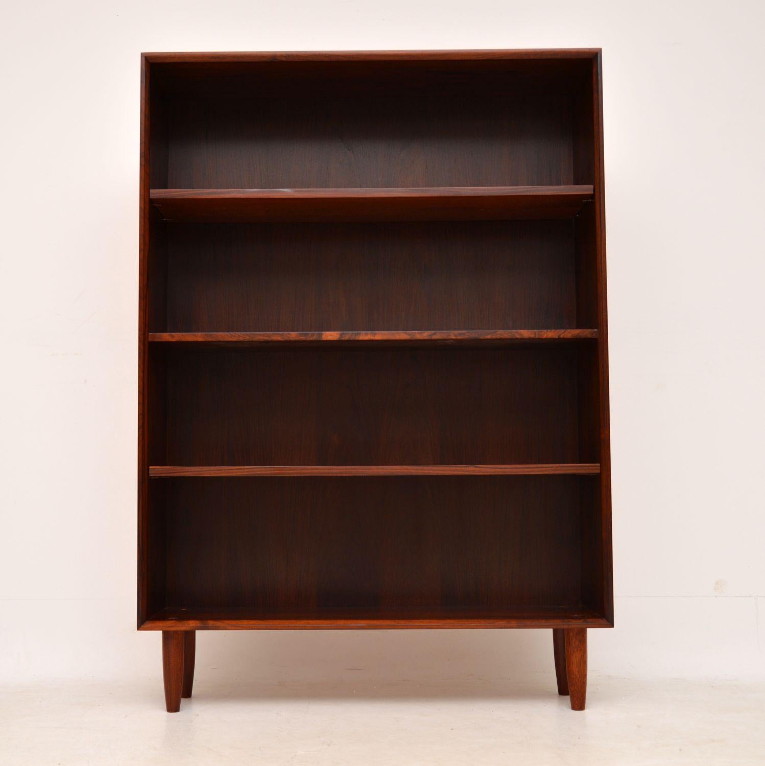 A stylish and useful vintage Danish bookcase, this was made in Denmark in the 1960s. We have had this stripped and re-polished to a very high standard, the condition is superb throughout. This has a gorgeous colour and beautiful grain patterns. The