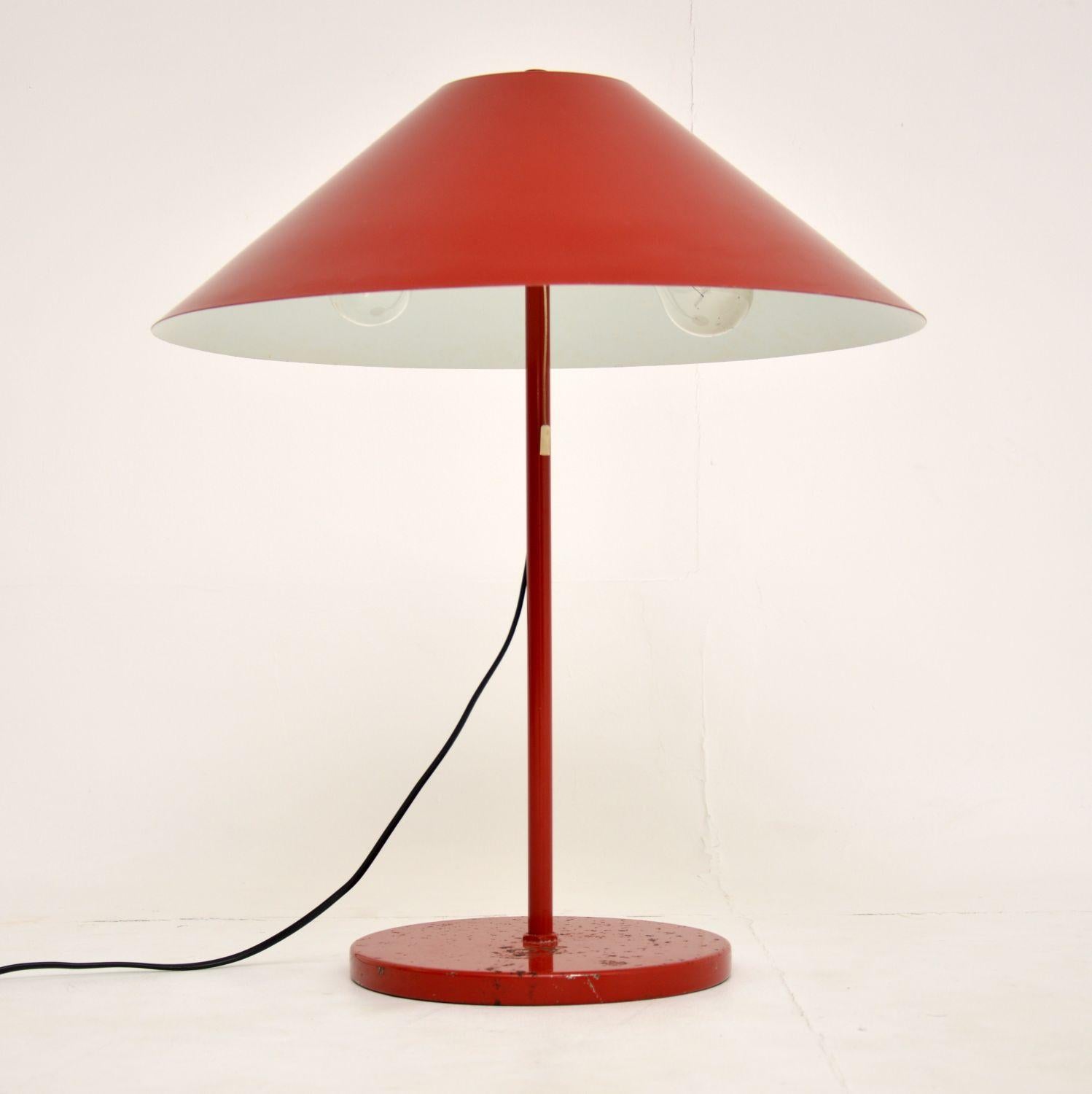 A stylish and interesting vintage Danish table lamp, dating from the 1960s-1970s. This was made by the high end manufacturer ES Horn, it has the original label beneath the base.

This has the beautiful original shade built in, the red lacquered