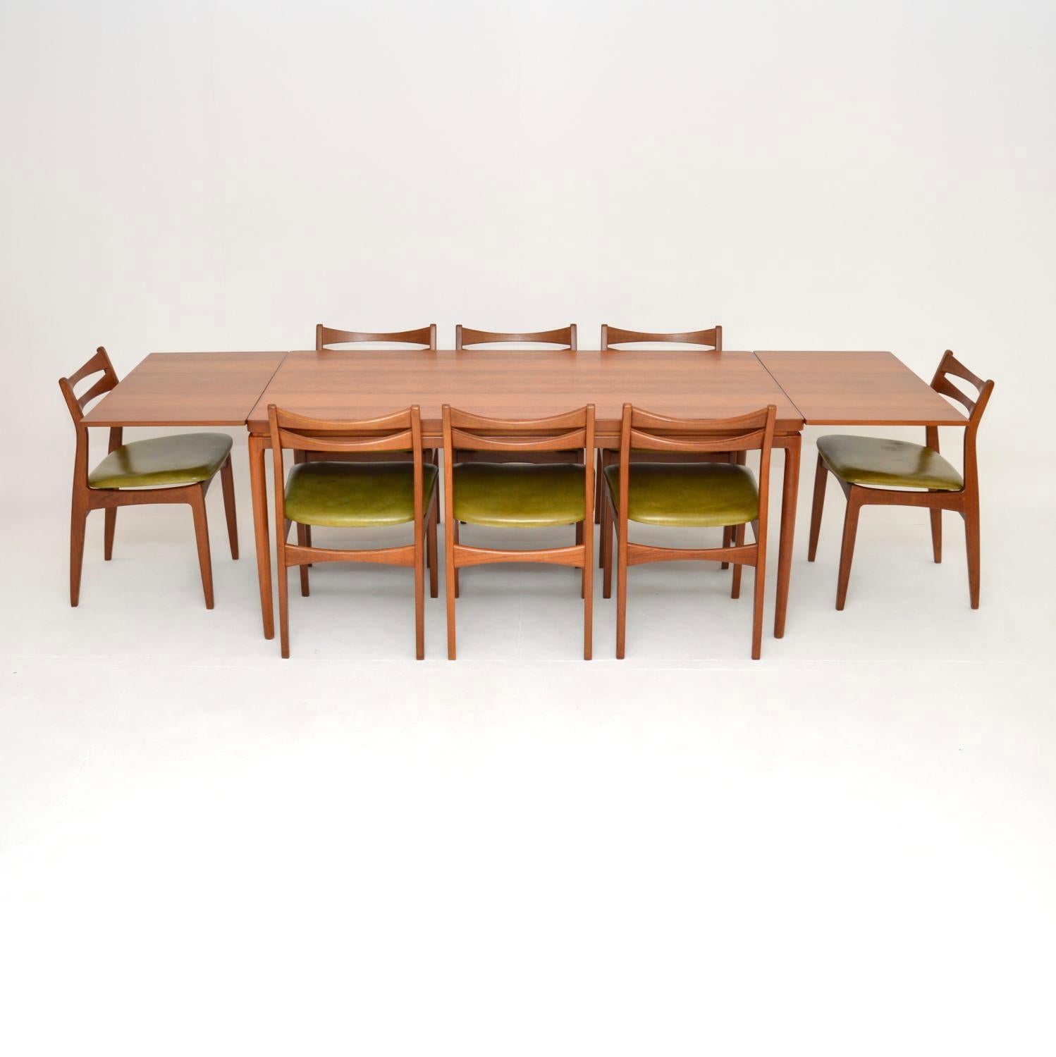 The dining table was designed by Johannes Andersen, it is of superb quality and is a great size. The solid teak dining chairs came with it, they may also be designed by Johannes Andersen, or perhaps another designer. The chairs have a beautiful