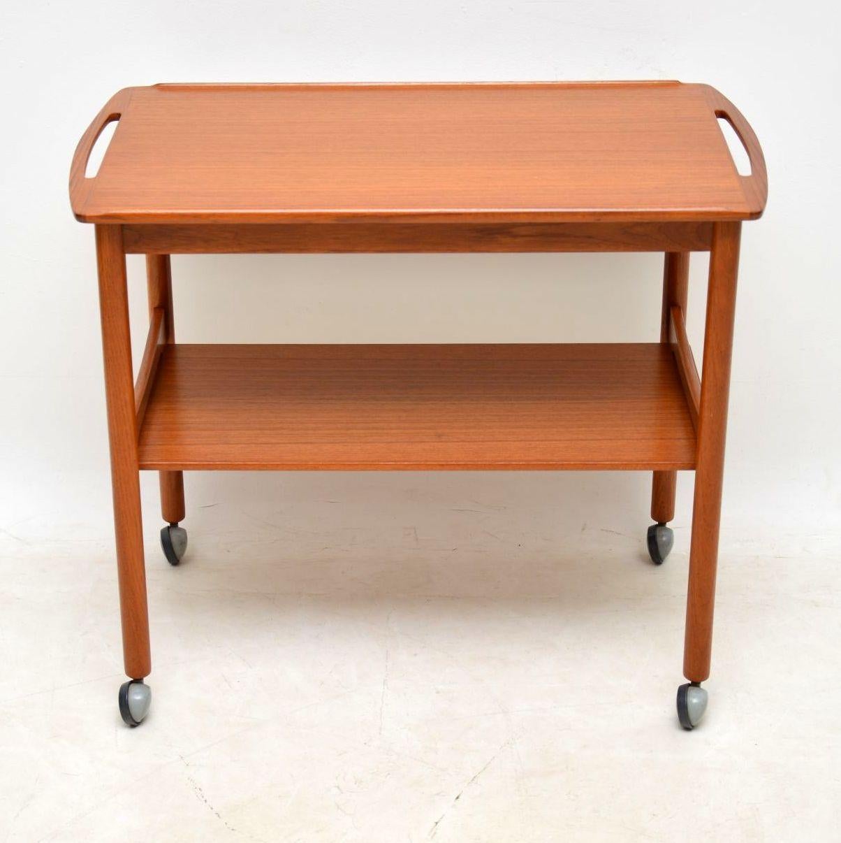 A smart, stylish and useful vintage Danish drinks trolley in teak, this dates from the 1960’s. It’s beautifully styled and is in superb condition for its age; we have just had this completely stripped and re-polished to a very high