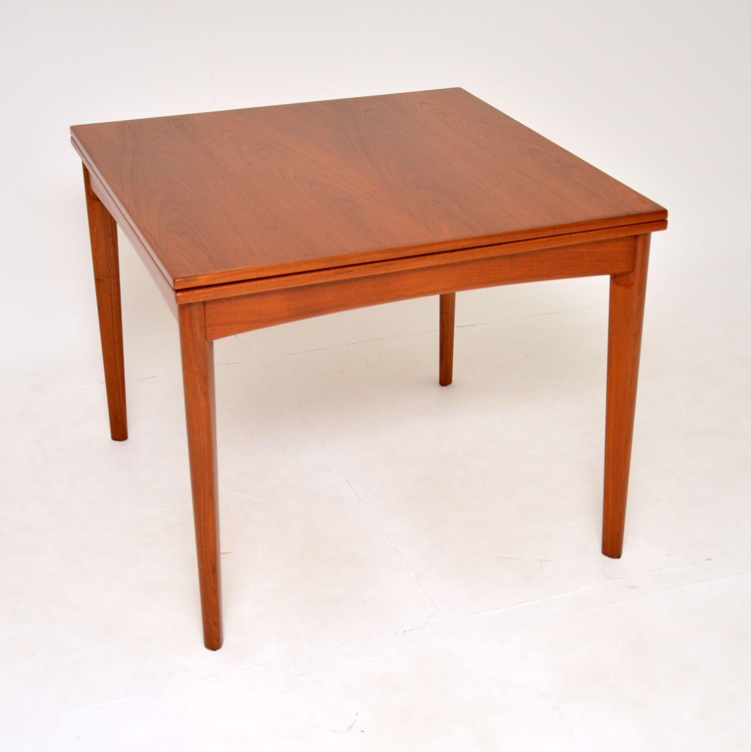 A stylish and very well made vintage Danish dining table in teak. This was made in Denmark, it dates from the 1960’s.

It is of super quality, with a clever mechanism to open it out and double the size. The top swivels round on a pivot and unfolds