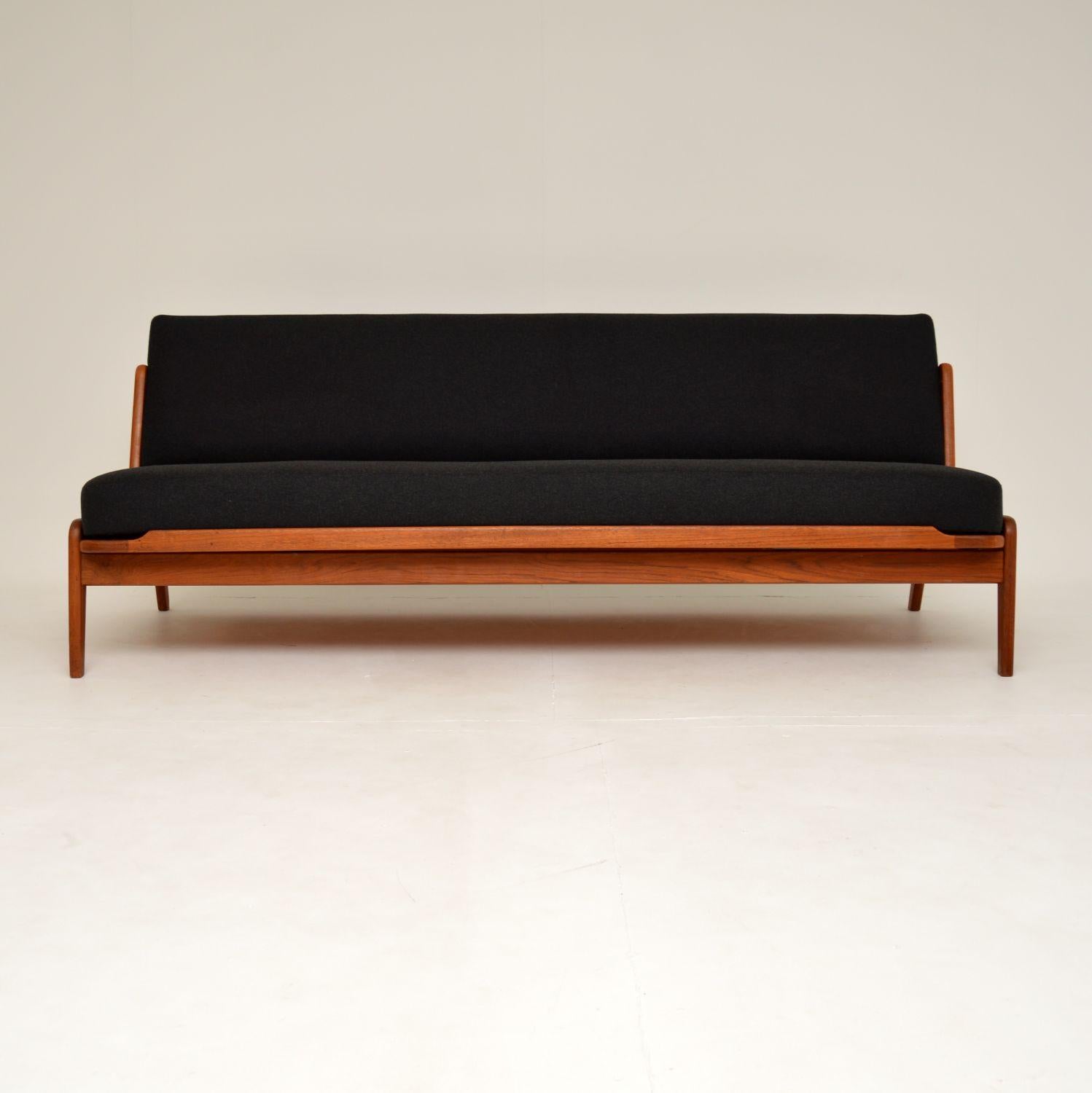 An excellent and very rare vintage Danish sofa bed in teak. This was made in Denmark by Komfort, it was designed by Arne Wahl Iversen and dates from the 1960-70’s.

The quality is fantastic, this has a very stylish and clever design. The seat