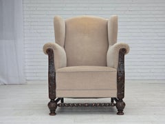 1960s, Danish wingback armchair, furniture velour, carved oak wood.