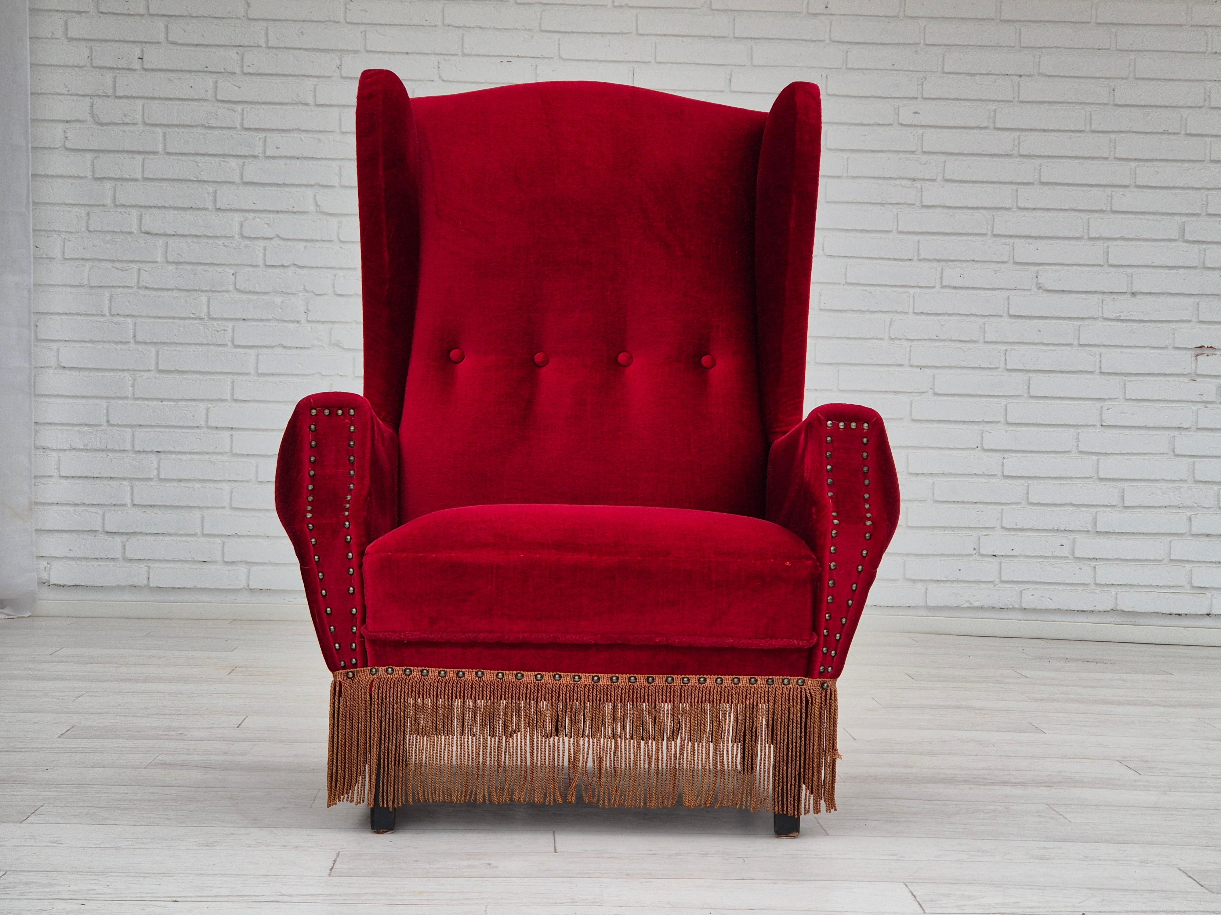 Scandinavian Modern 1960s, Danish wingback armchair, original, furniture velour, oak wood legs. For Sale