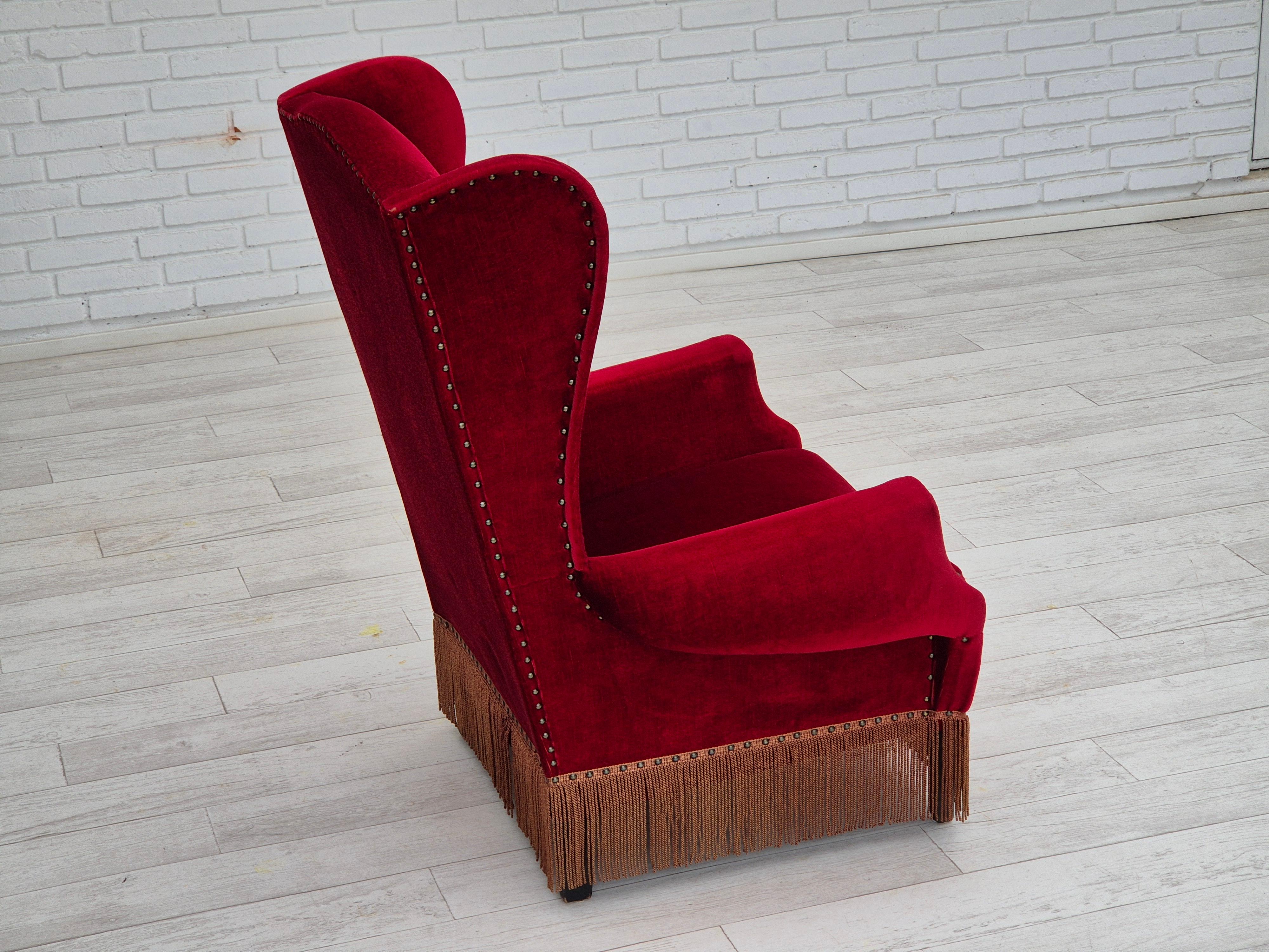 Mid-20th Century 1960s, Danish wingback armchair, original, furniture velour, oak wood legs. For Sale