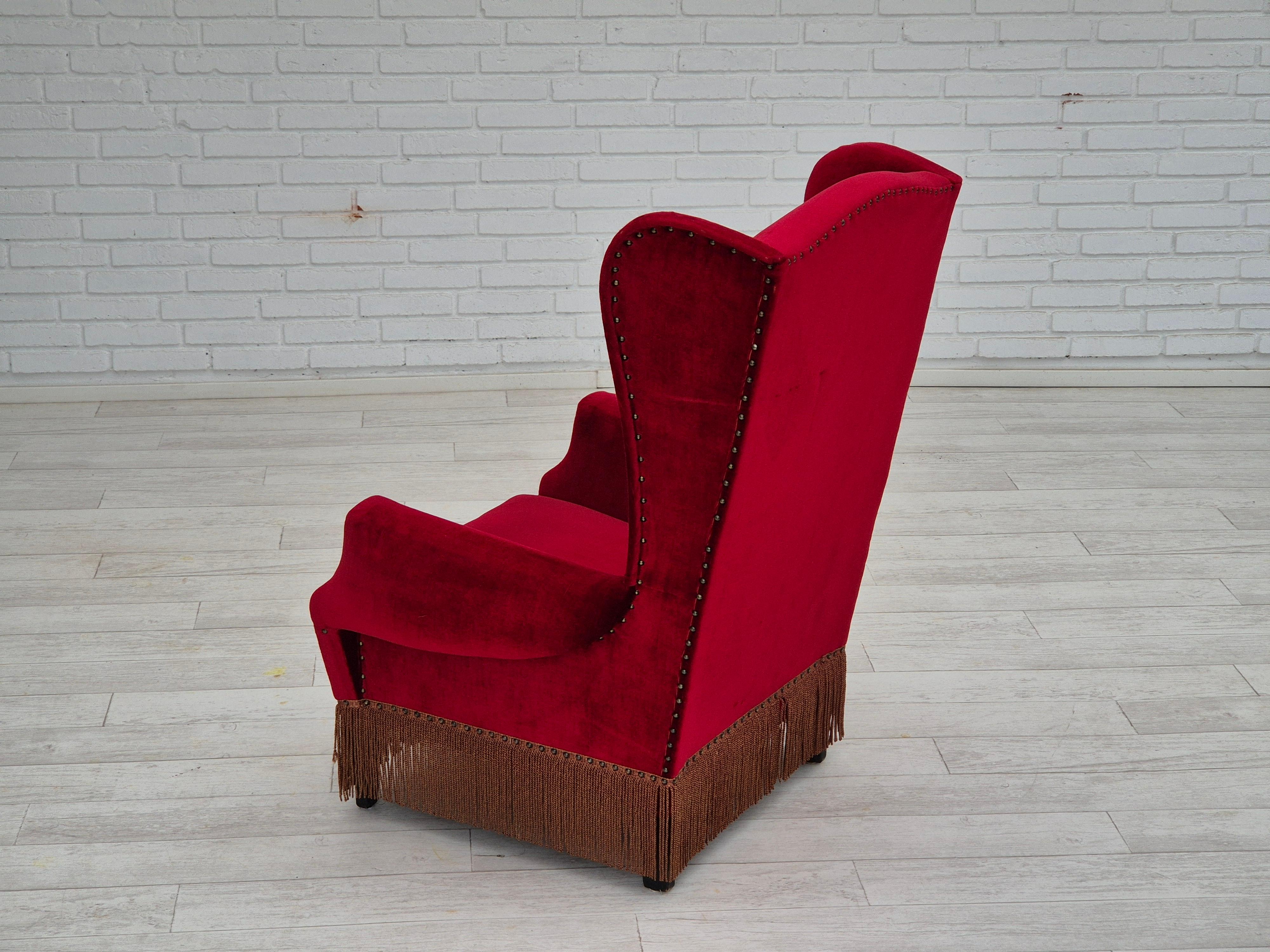 1960s, Danish wingback armchair, original, furniture velour, oak wood legs. For Sale 1