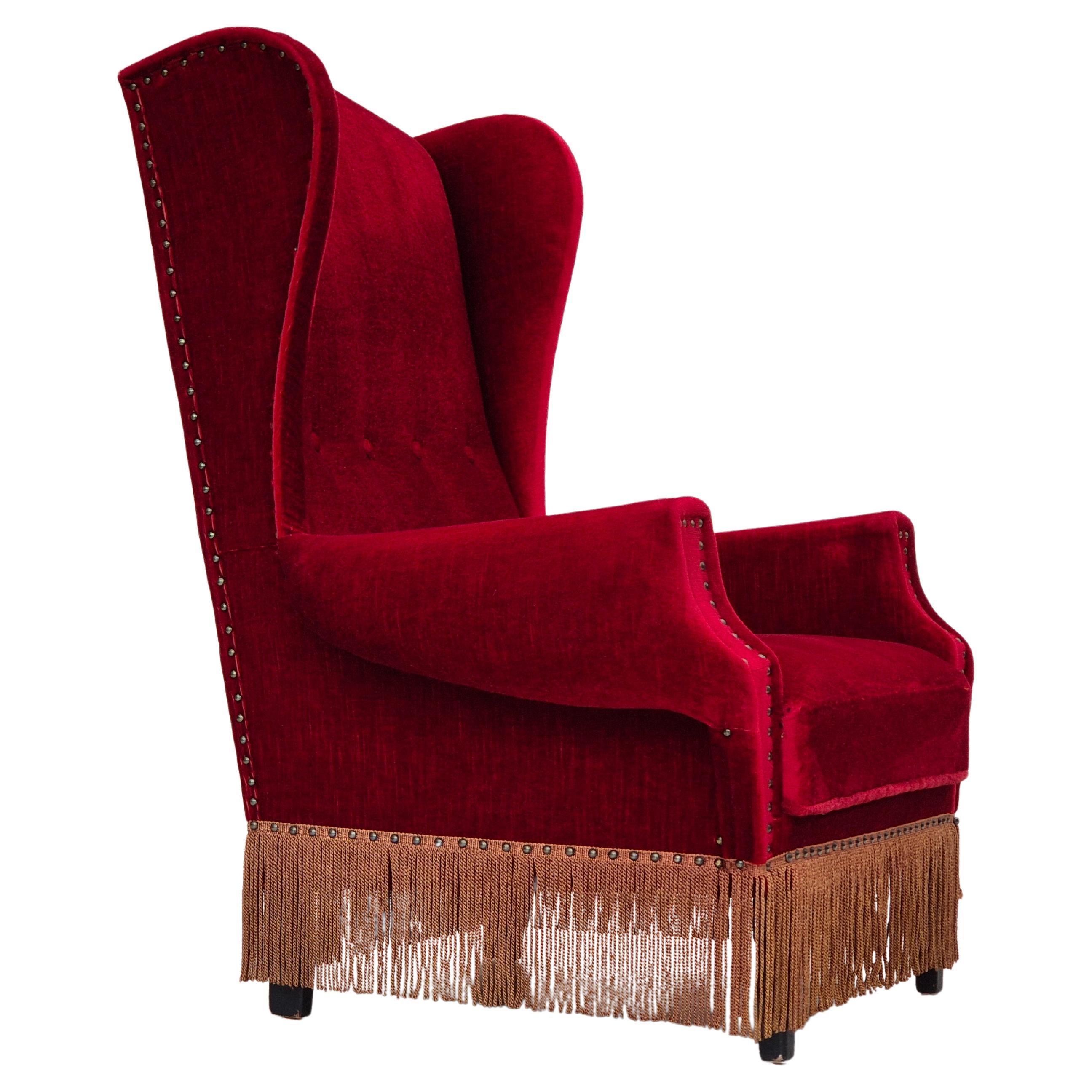 1960s, Danish wingback armchair, original, furniture velour, oak wood legs. For Sale