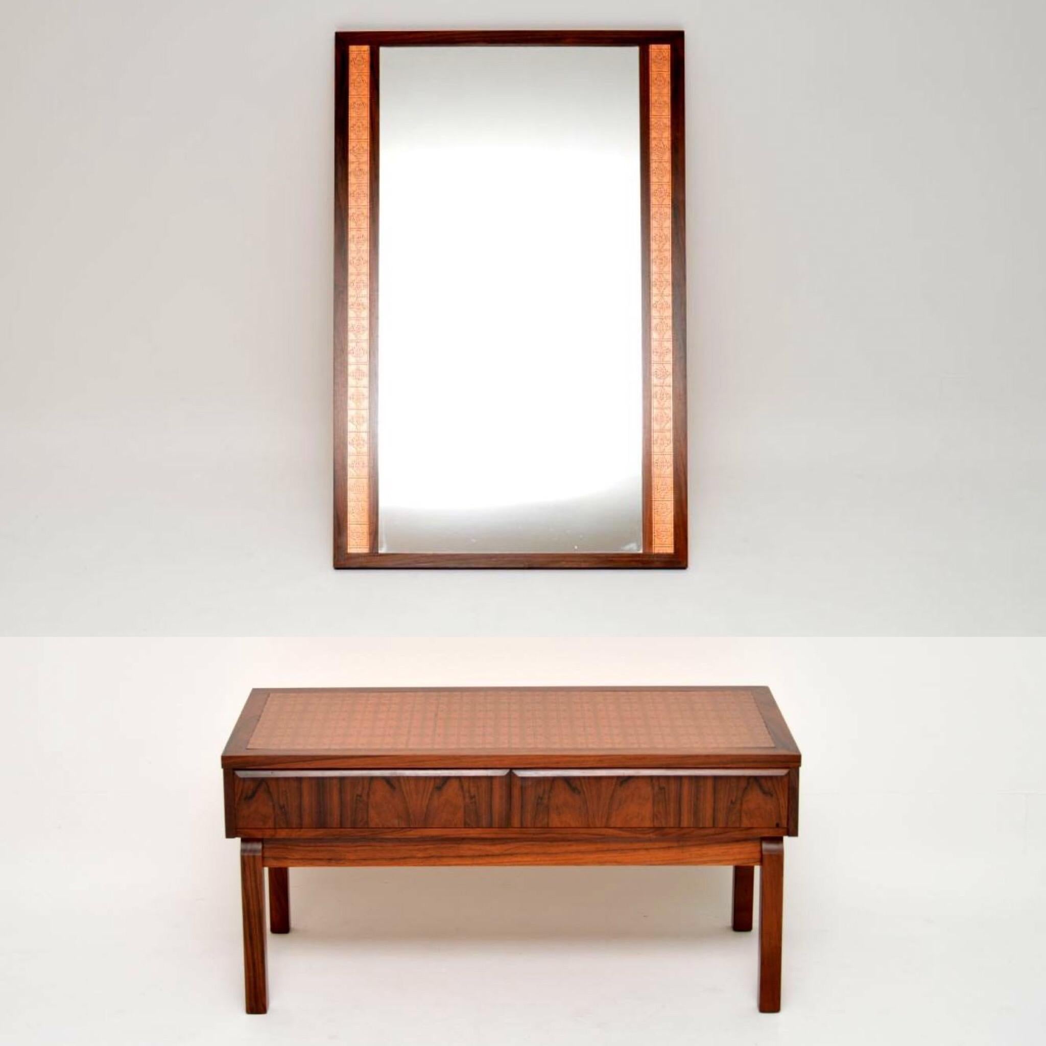 A stunning and very rare matching set, this consists of a side table and a mirror, both inlaid with copper. They are both in superb original condition, with hardly any wear to be seen. The wood grain patterns are stunning throughout, with gorgeous