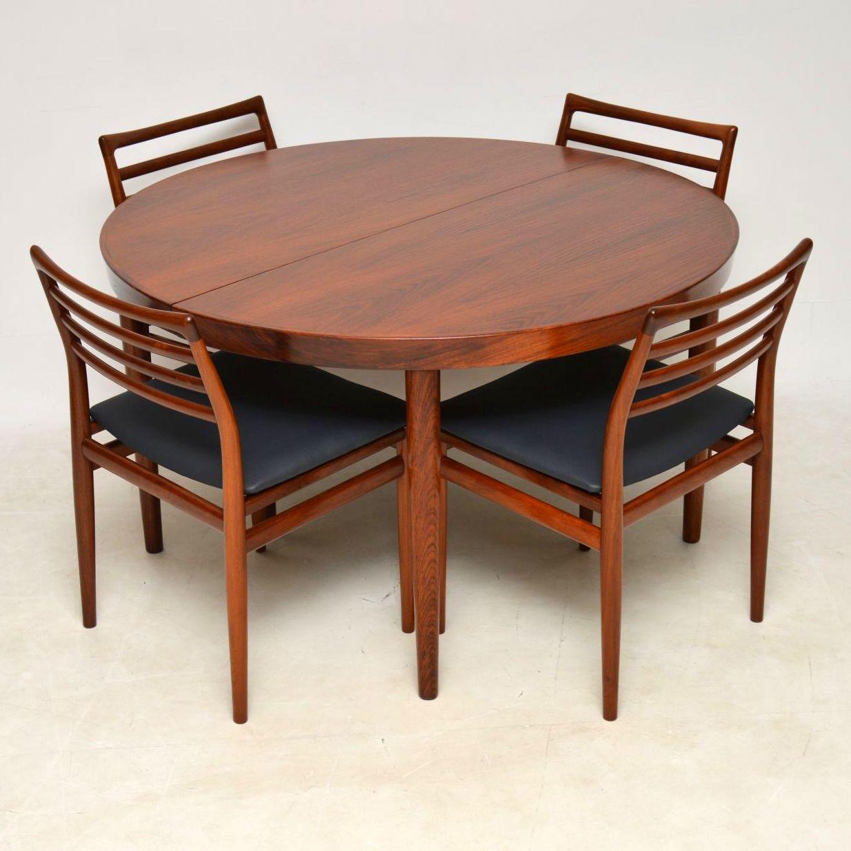 A magnificent vintage Danish dining suite made in the 1960s, consisting of six solid wood dining chairs and an extending wood dining table. These were designed by Erling Torvits, and were made by Sorø Stolefabrik. We have had the chairs and table