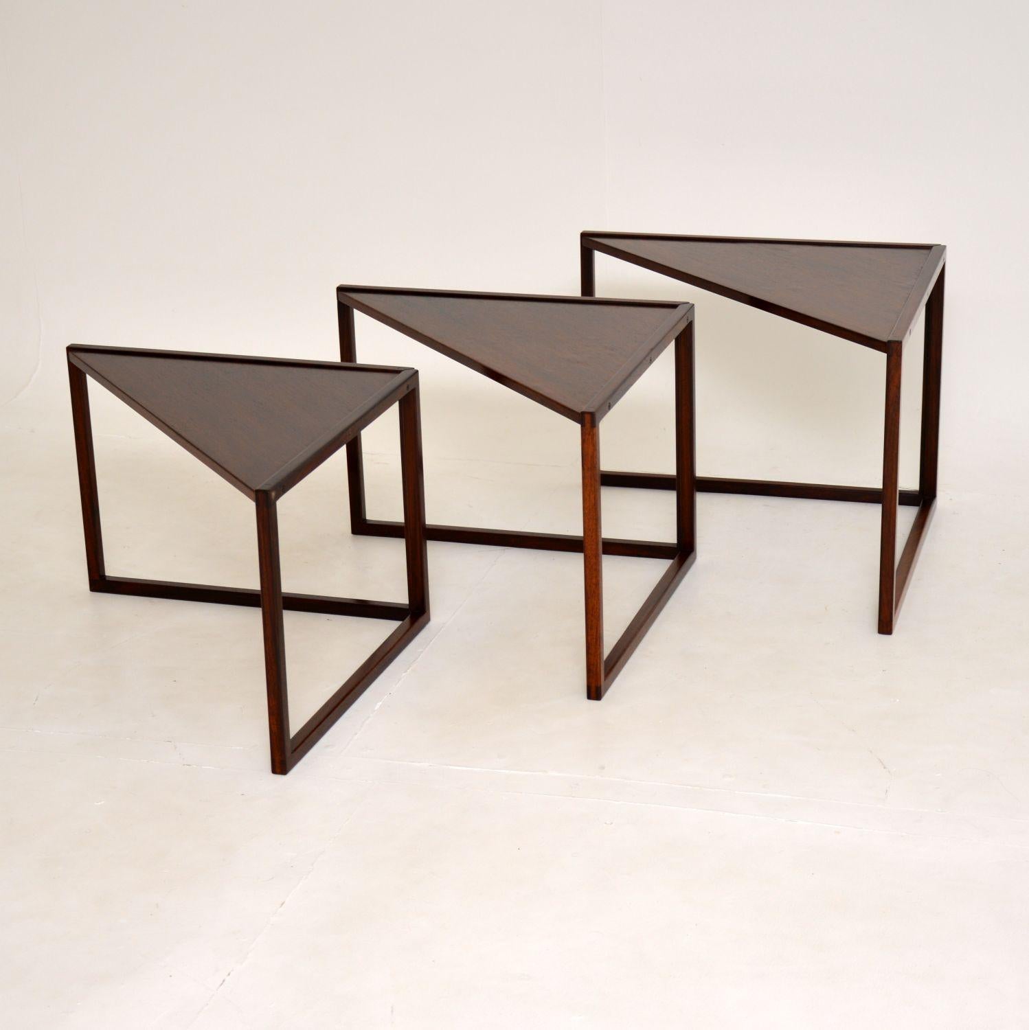 A stunning and extremely rare Danish nest of tables. These were designed by Kai Kristiansen, they were made in Denmark by Vildbjerg Mobelfabrik and they date from the 1960’s.

The triangular shaped design is very stylish and practical, the tops
