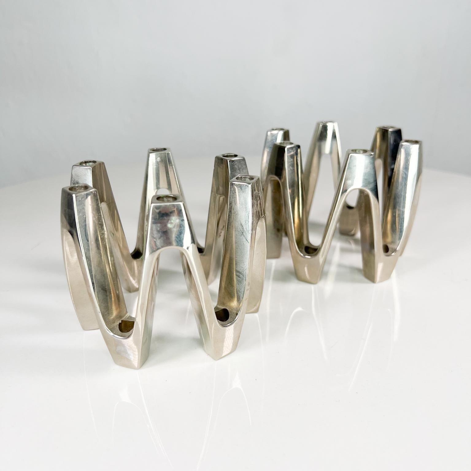 1960s Dansk by Jens Quistgaard JHQ Mid-Century Modernist crown candle holders in silverplate.
Can accommodate 6 thin tapered candles each.
Marked 'Dansk' to the underside.
Measures: 3.63 diameter x 3 tall
Preowned original vintage condition,