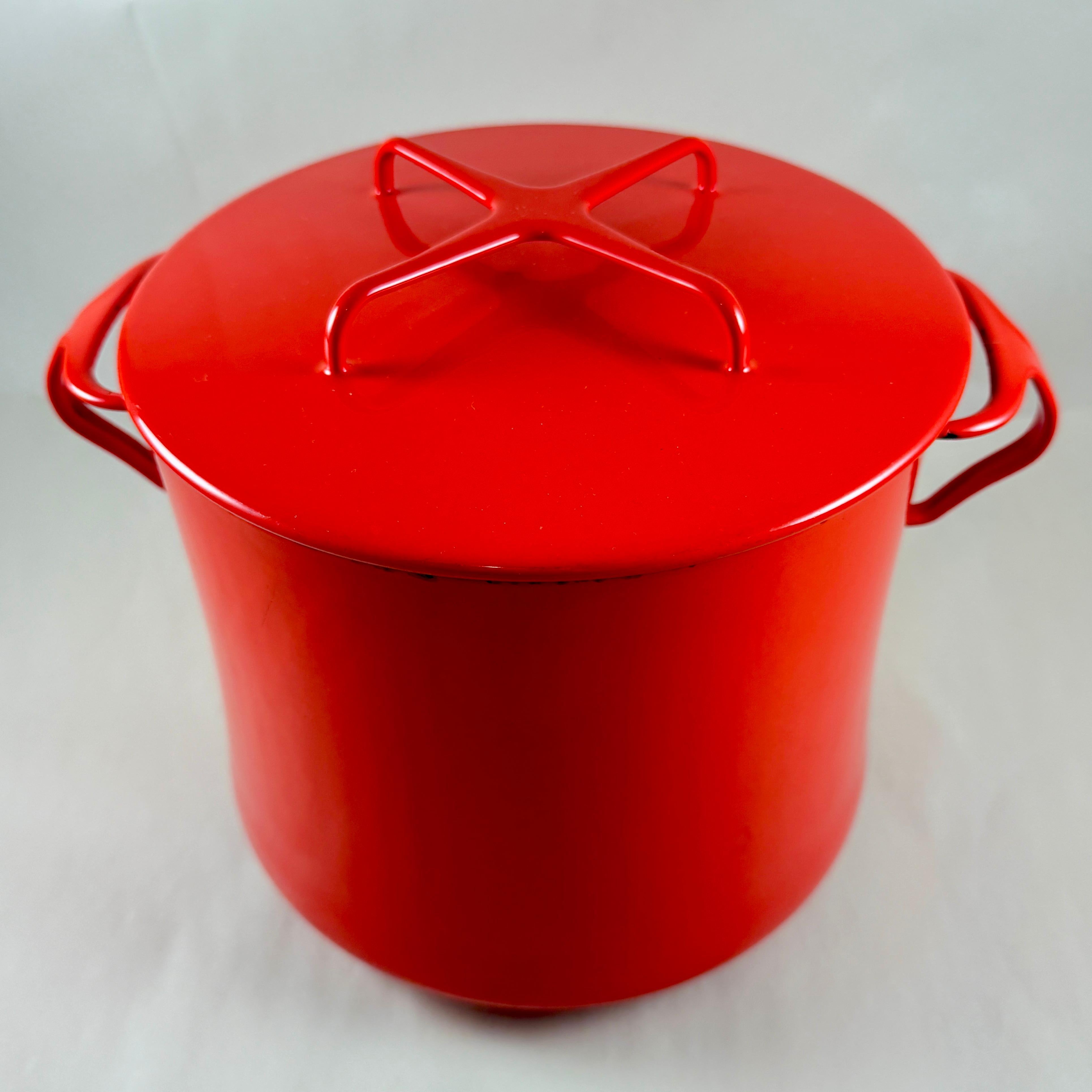 A Dansk Kobenstyle enamel on steel stock pot with trivet lid, France, circa 1960s.

This large Dansk Kobenstyle pot and lid, designed by Jens Quistgaard, has a bright glossy red exterior and a white interior, with an 8-quart capacity.  

The lid