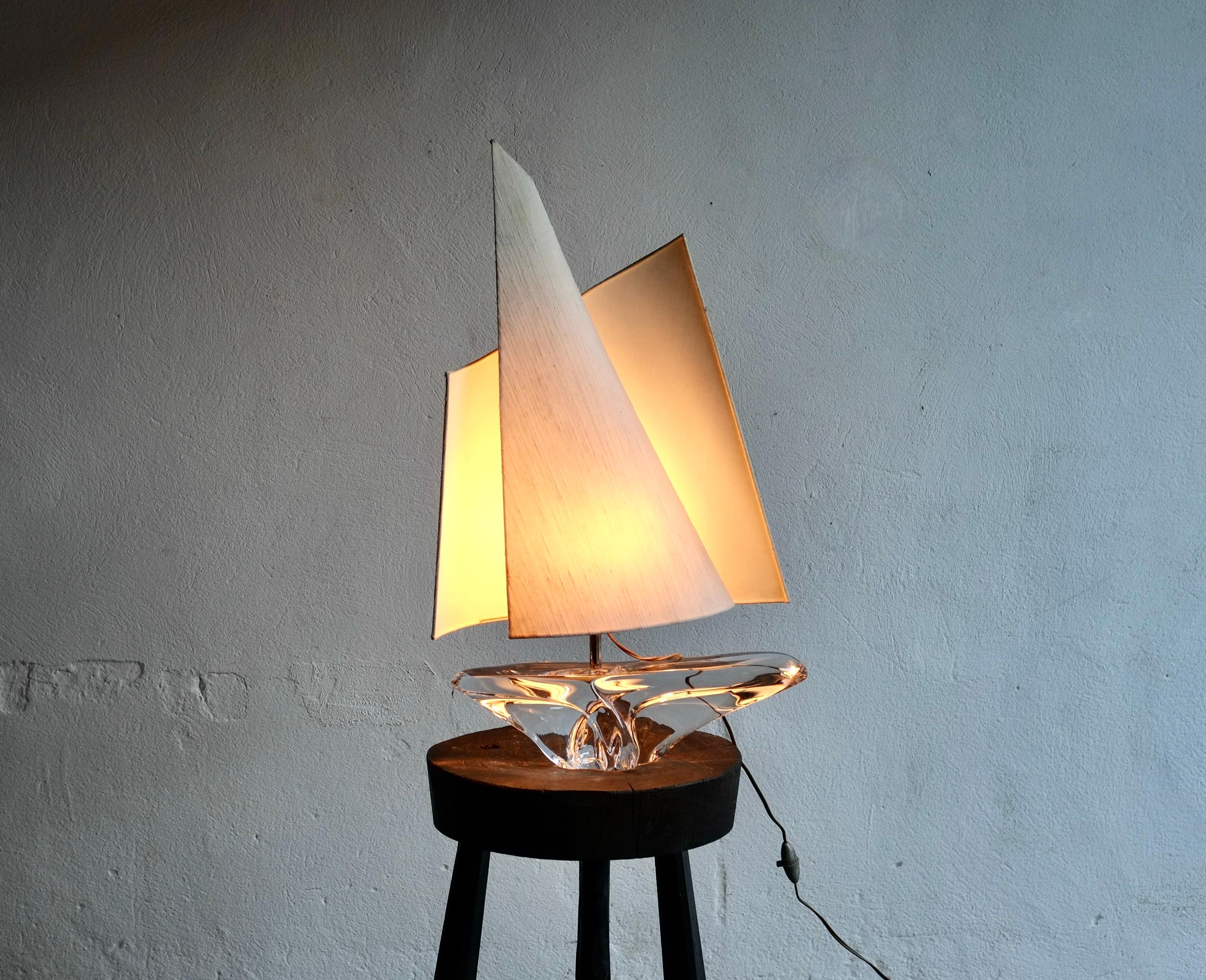 A large sailboat lamp manufactured by Daum, France in the 1960's.

Crystal glass base with a striking sculptural shade. The glass in in fabulous condition with no damage, one of the internal rods in the shade has had a solder repair.

Including