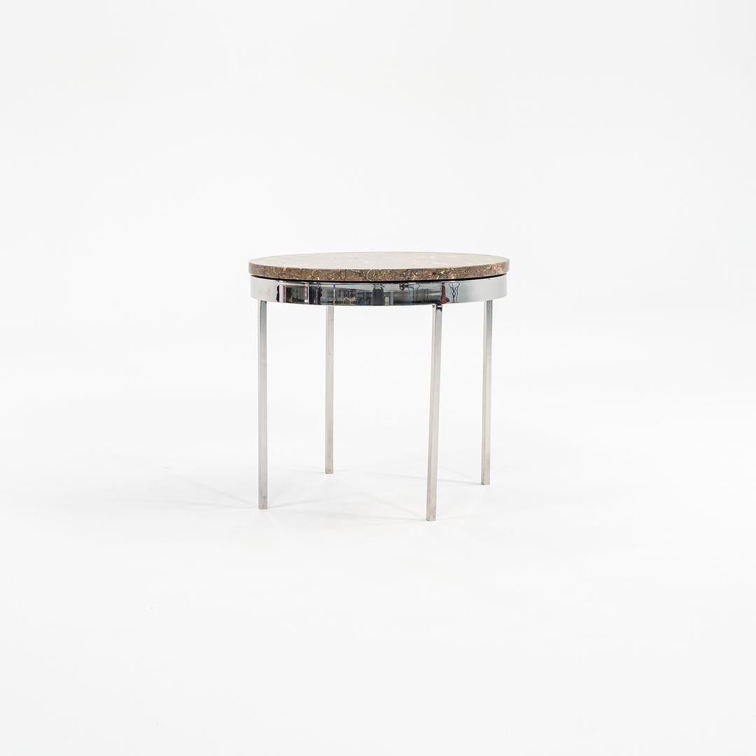 This is a Round Side Table, designed by Davis Allen under the leadership of Gordon Bunshaft within SOM. Its possible that Nicos Zographos played a role in the execution of this, though the detailing is more typical of Davis Allen's work due to the