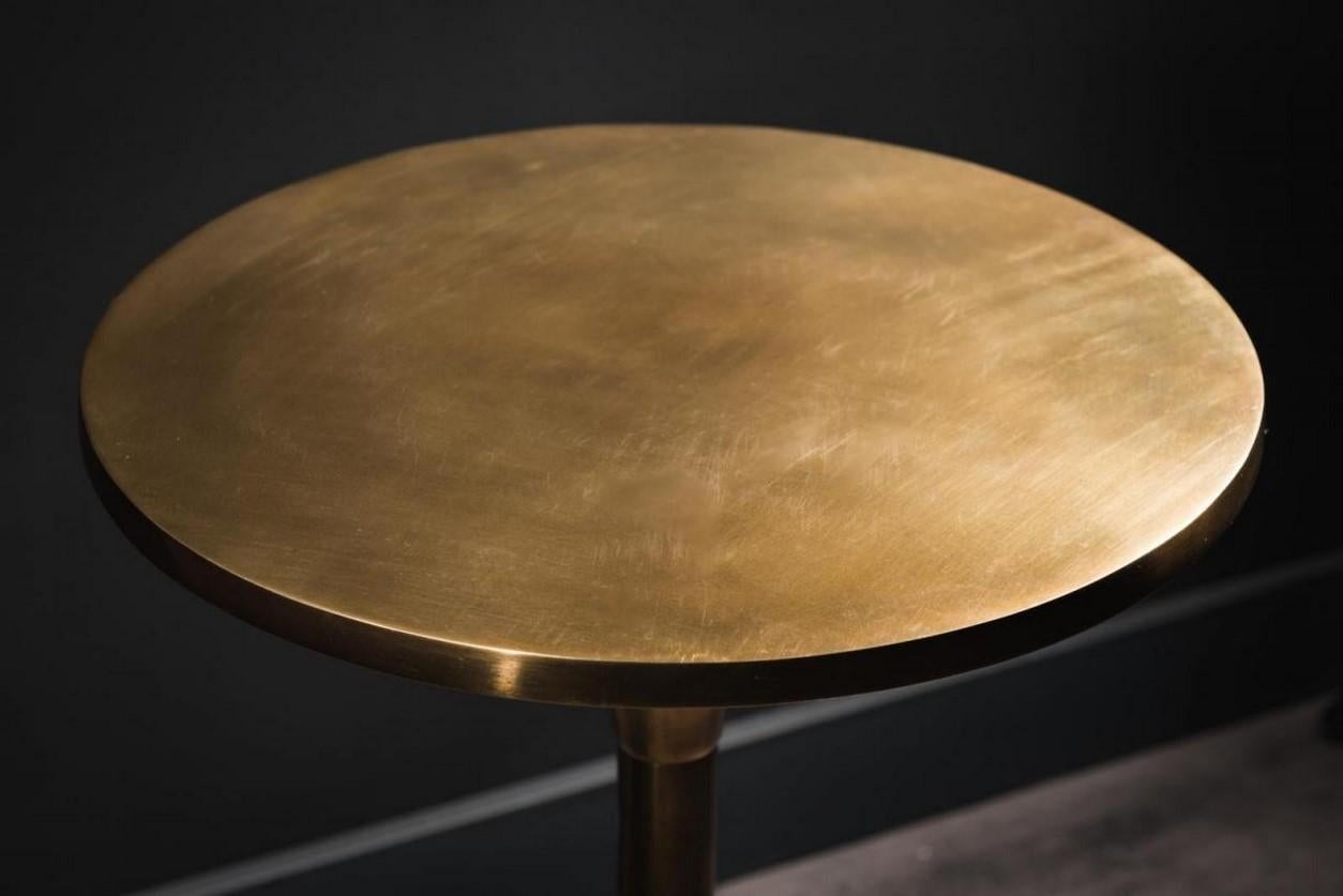 Pair of MCM design style patina brass finishes metal side tables.
