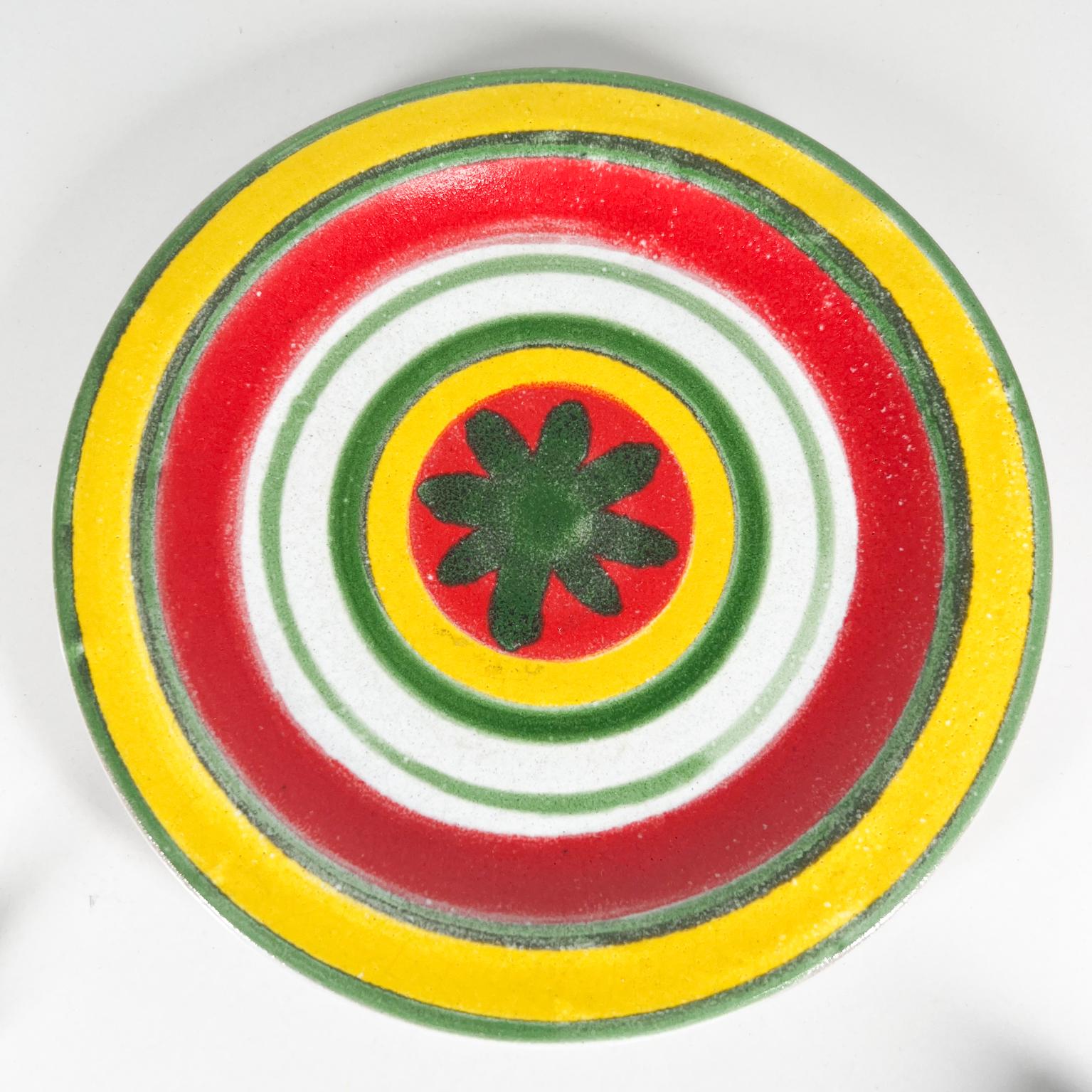1960s Desimone ceramic pottery Italy Art Plate
Hand painted in Yellow Red and Green 
Giovanni Desimone Italy
8.38 diameter x .75 tall
Inscription: Desimone Italy 64/15 AC
Original vintage condition.
Refer to images.
 

