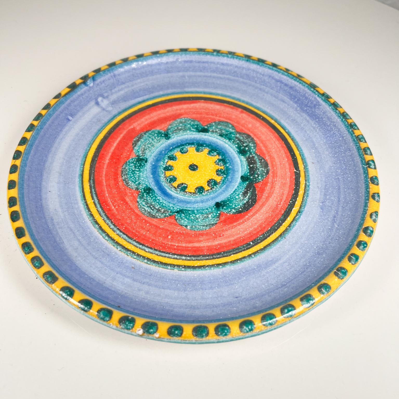 1960s, DeSimone pottery of Italy colorful ceramic art hand painted blue flower plate.
Giovanni Desimone Italy.
Colorful blue flower.
Measures: 8.88 diameter x .88 tall.
Inscription on the back: Desimone A 13.
Original vintage condition.
Refer