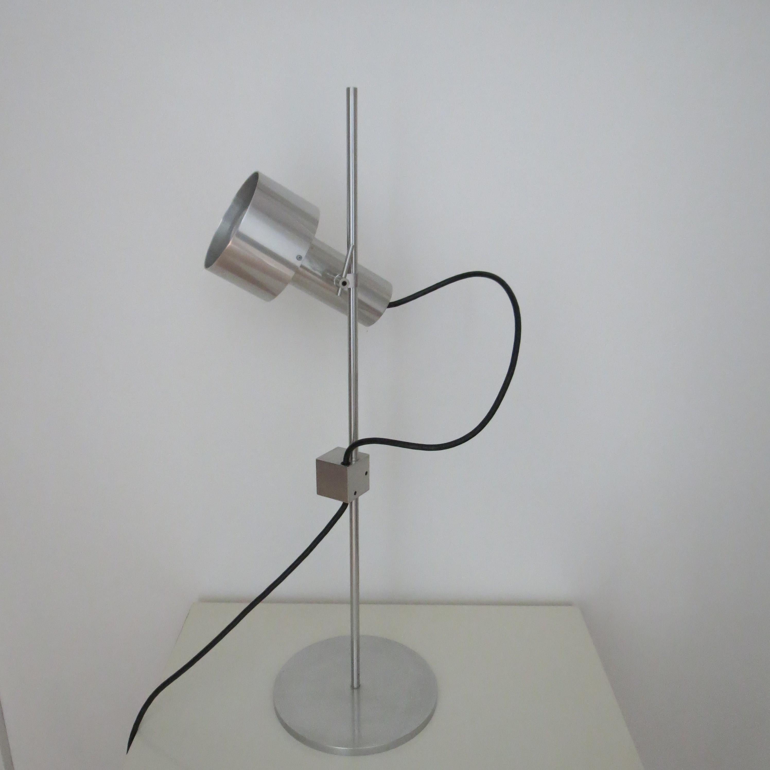 Peter Nelson Aluminium Single Spot Desk Lamp early 1960s

Wonderful desk lamp designed by Peter Nelson and produced by Architectural Lighting Ltd. With a single spot light, (this lamp has the longer version) fully adjustable lamp which moves up and