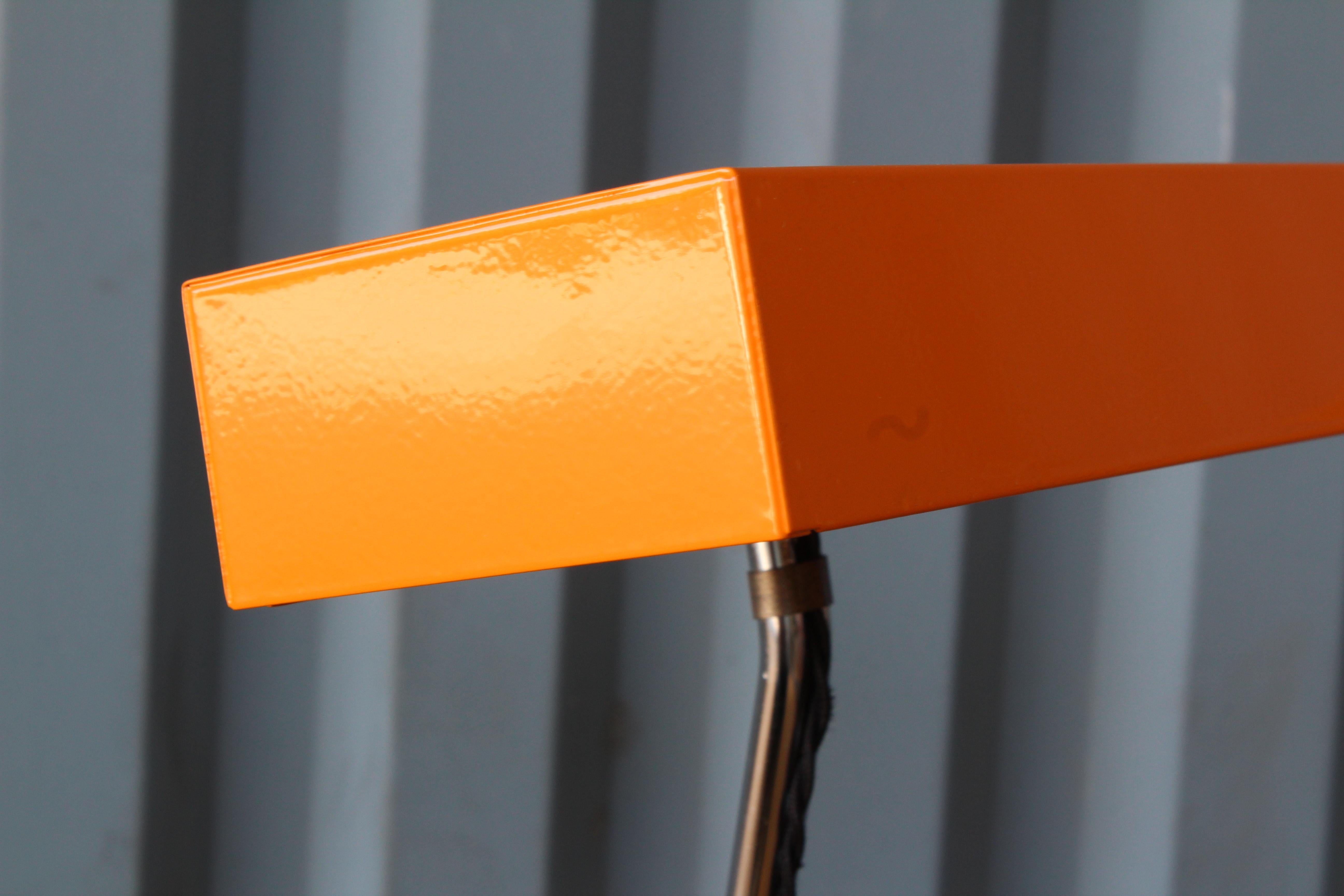 1960s modern desk lamp with an orange metal shade. Newly rewired.