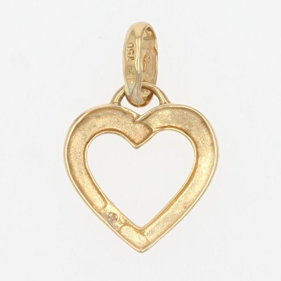 Pendant in 18 karat yellow gold.
This thin pendant has the shape of a heart and is decorated with a diamond.
Height : 1,5 cm, width : 10,2 mm, thickness : 0,9 mm approximately.
Total weight of the jewel : 0,6 g approximately.
Authentic antique