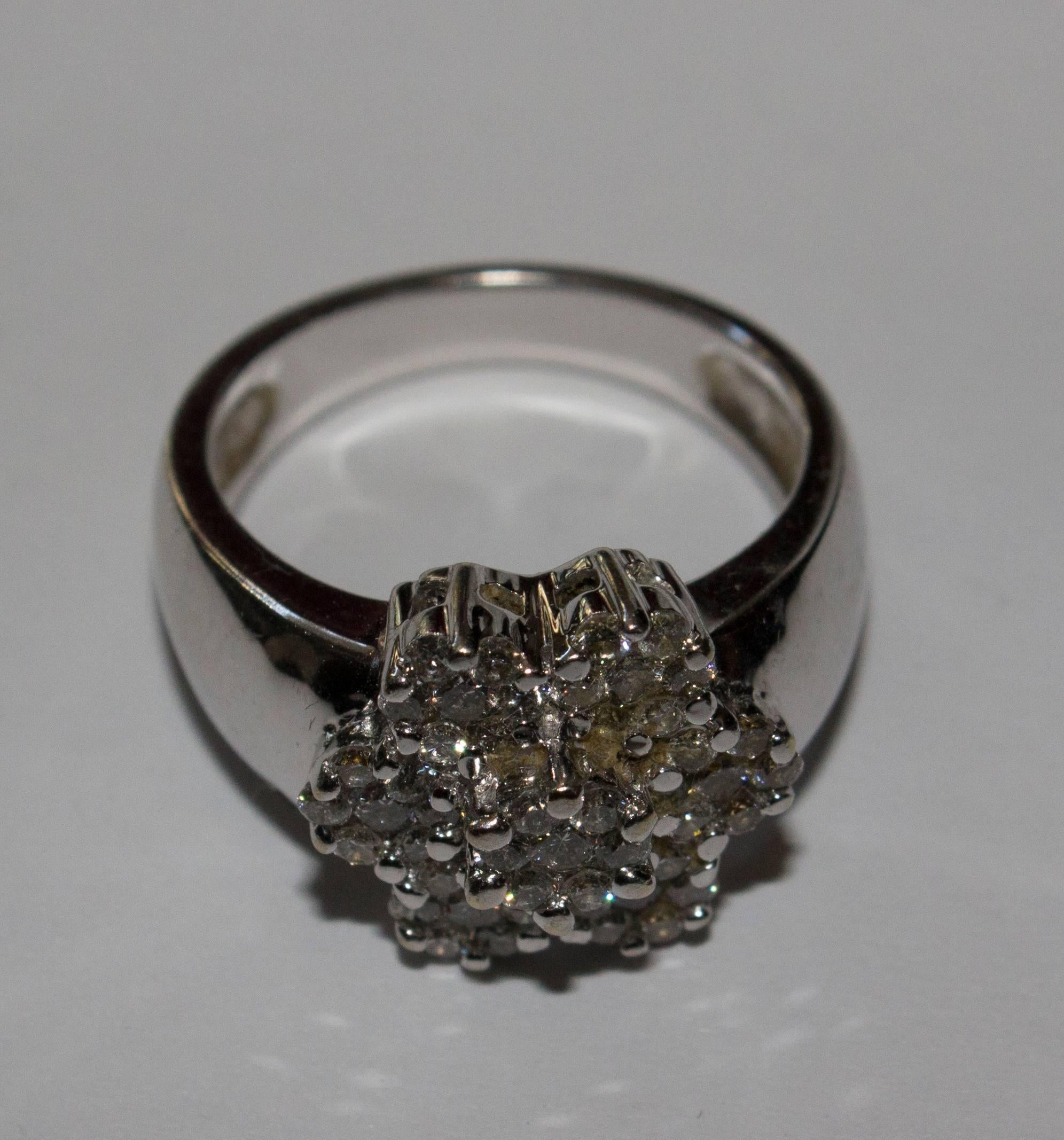 A great cluster cocktail ring with a wide band, typical of the time