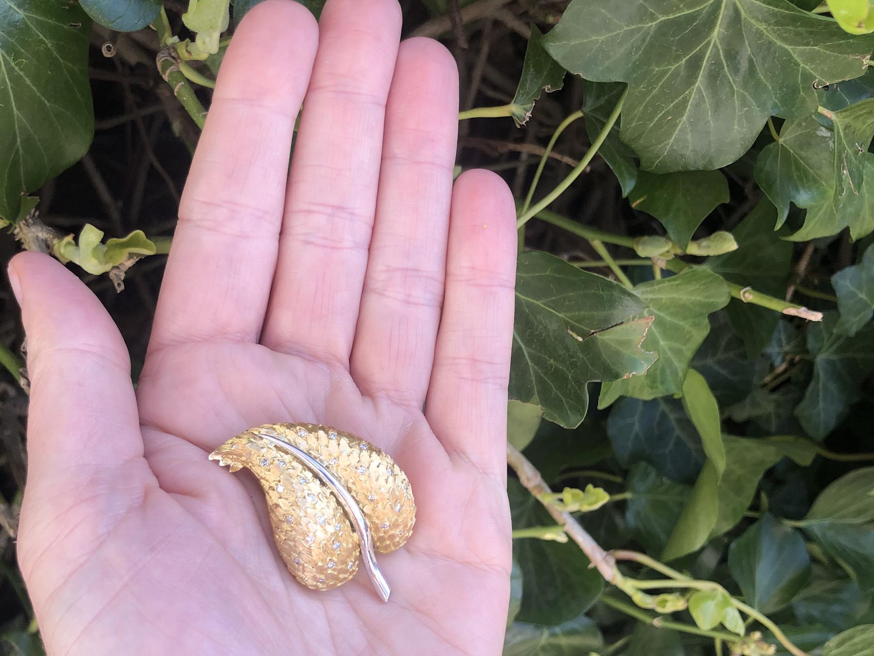 A fine and impressive vintage 0.32 carat diamond, 18 karat yellow and white gold 'leaf' brooch; part of our diverse ruby jewelry and estate jewelry collections

This stunning, fine and impressive gold brooch has been crafted in 18k yellow