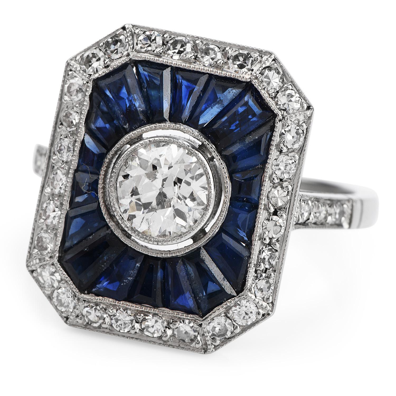 This elegant diamond and sapphire cocktail ring is crafted in solid platinum, weighing 6.7 grams and measuring 17mm x 6mm high. Simulating a rectangle frame, it centered with one genuine European cut diamond weighing approx.0.60 carats H-I color, VS