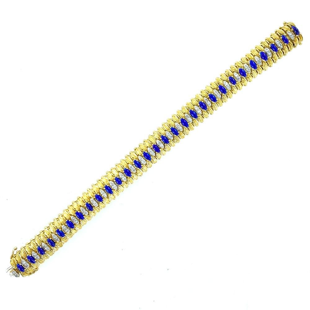 Beautifully crafted diamond blue enamel bracelet circa 1960's. The handcrafted flexible bracelet is fashioned in 18 karat yellow gold. Blue enamel and 58 white diamonds (1.00 CTW) alternate down the center of the bracelet. The bracelet measures 7