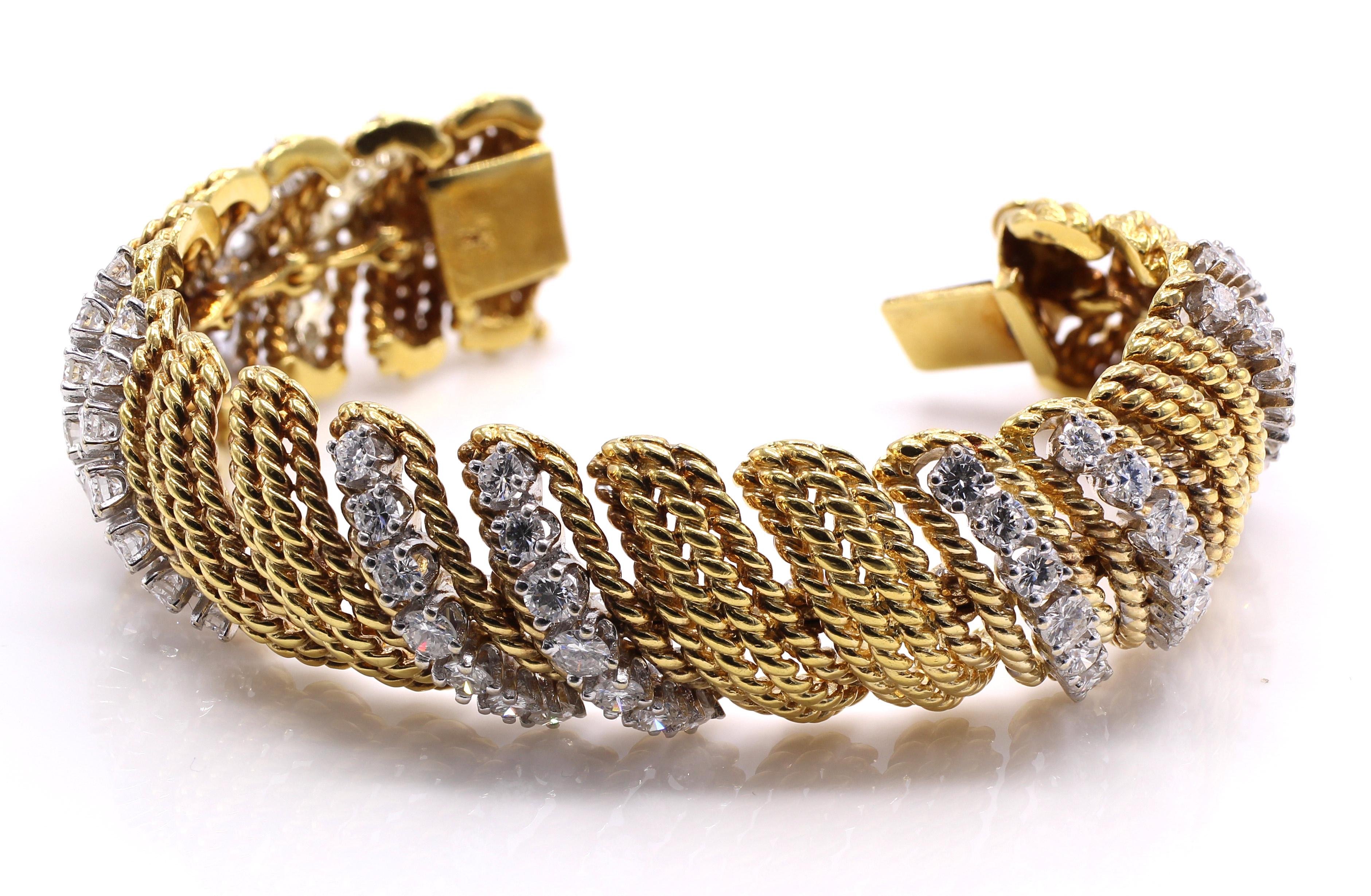 Beautifully designed and masterfully handcrafted in 18 karat yellow gold bracelet ca. 1960. 6 sections of curved textured gold links are intersected by 5 sections of double rows set with bright white and sparkly perfectly matched brilliant cut