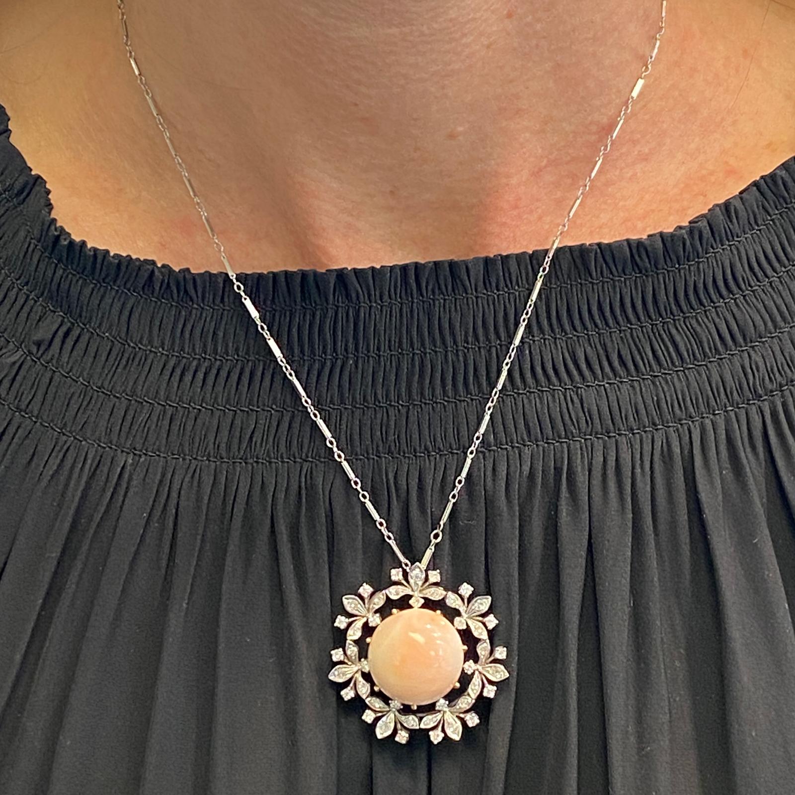 Diamond coral vintage pendant necklace fashioned in 14 karat white gold. The pendant (which can also be worn as a brooch) features 42 single cut diamonds weighing 1.00 carat total weight and graded H color and SI clarity. The diamonds are set in an