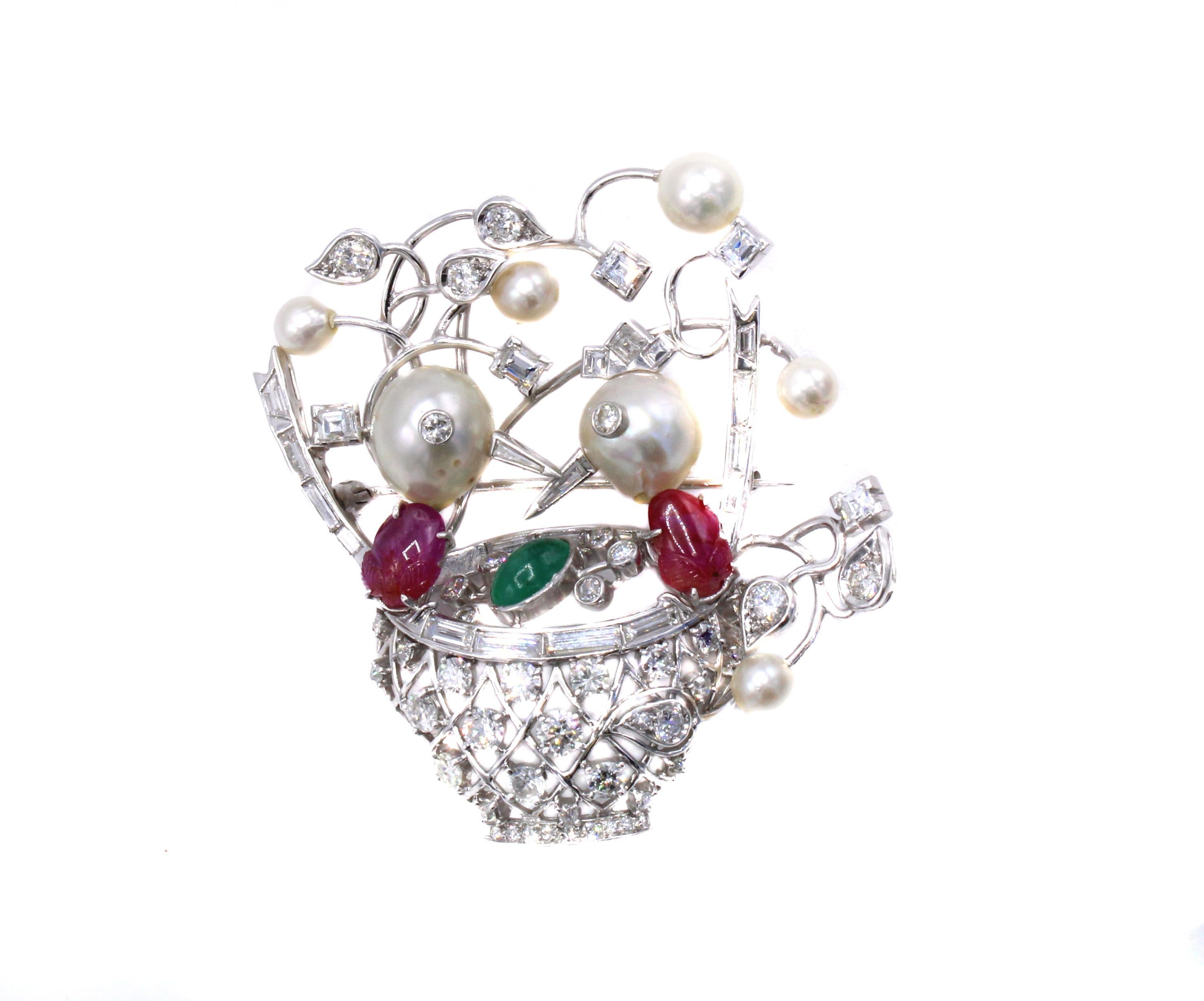 Beautifully designed and masterfully hand-crafted this unique brooch worked in platinum depicts a pair of birds in a birds nest. The whimsical over-sized heads are cultured pearls bezel set with round brilliant cut diamonds which each have a pointed
