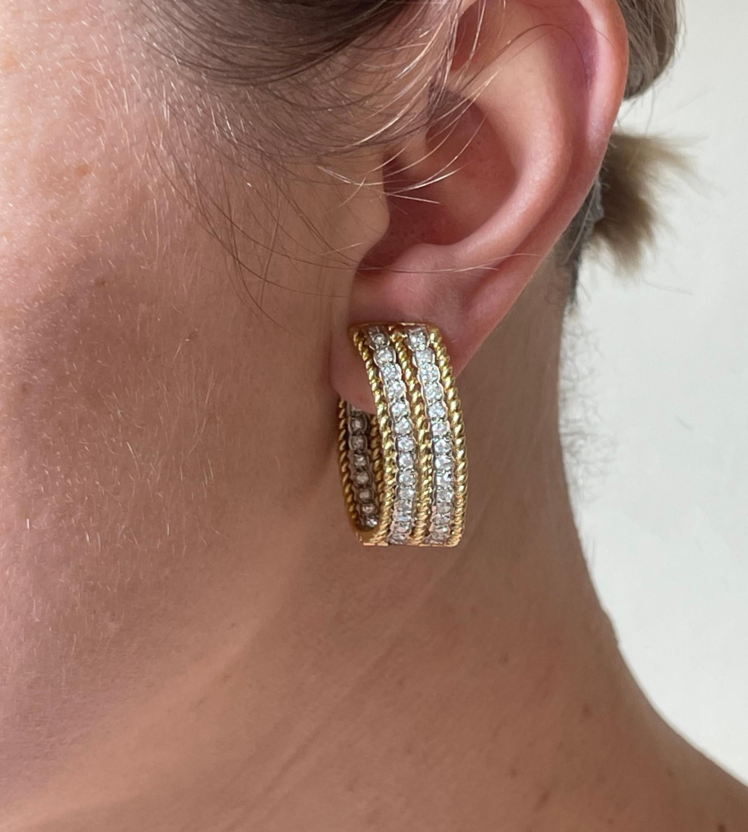Pair of vintage circa 1960s 18k gold hoop earrings, set with approx. 2.24ctw H/SI diamonds. Earrings do not have posts. Hallmarked with 18k stamp. Earrings measure 1.25