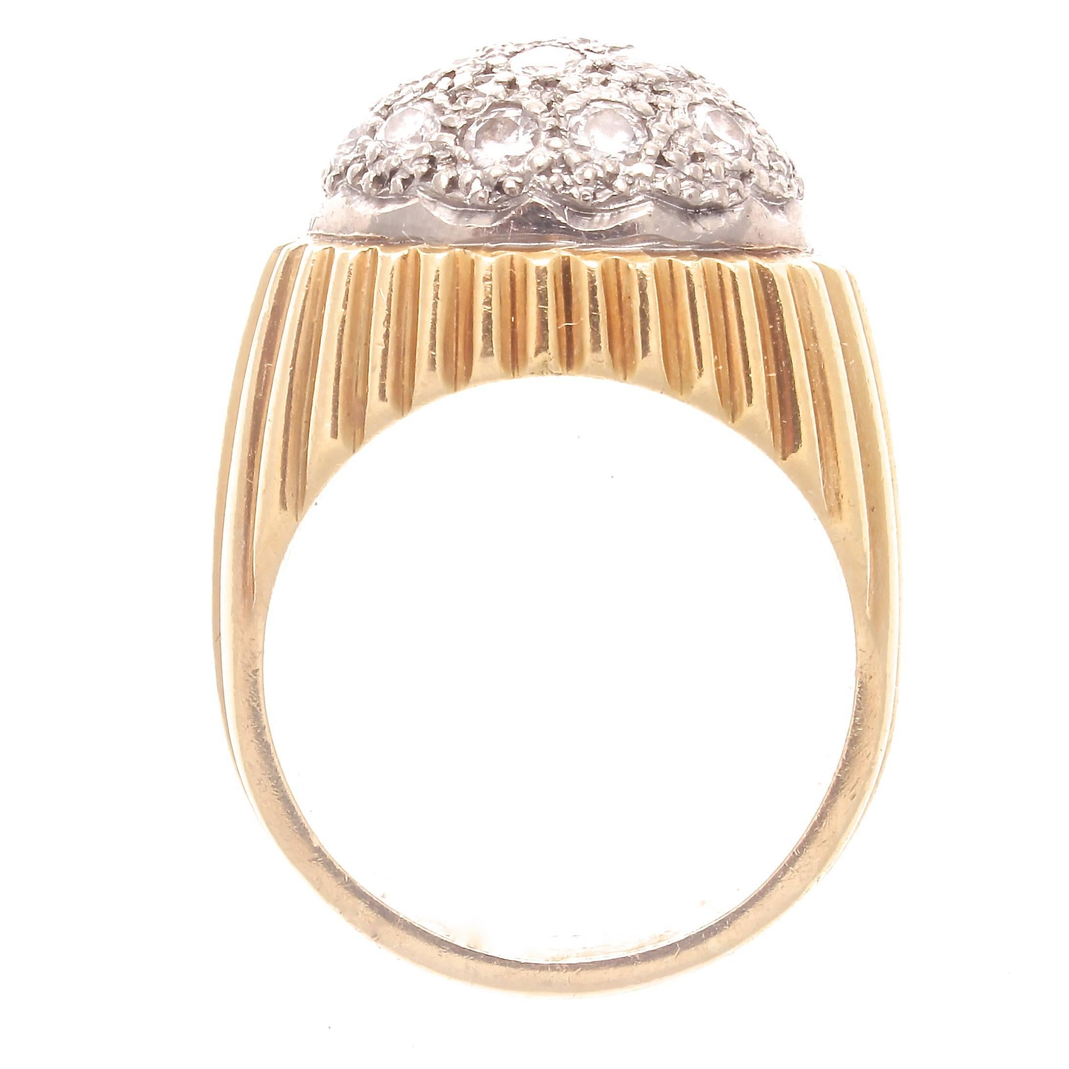 Expression through stylistic design. Featuring a lively dome of diamonds, gracefully set in platinum that is artistically atop streaking lines of 18k yellow gold.

Ring size 4-3/4 and can easily be resized to fit, if needed this would come