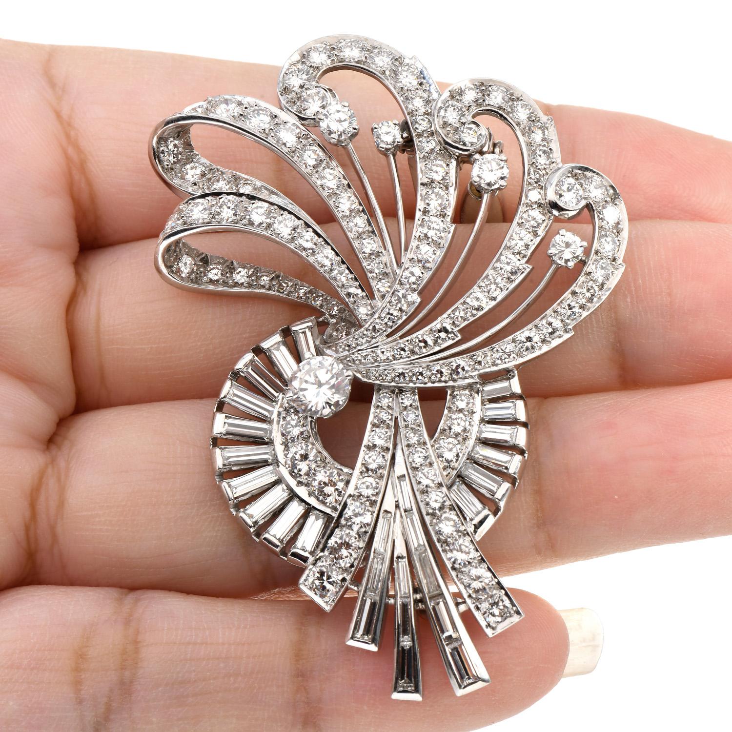 This fabulous vintage diamond Brooch Pin was inspired by a floral motif with winged movement and a beautiful flow, crafted in Luxurious Platinum.

Features a center Round Cut Genuine Diamond of 0.75 carats, G-H, VS1, and it is adorned by 119 Round