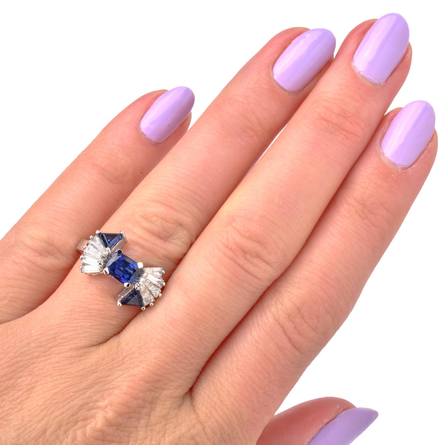  Captivating Twilight Blue Sapphire gracefully rests alongside tapered baguette diamonds forming a beautiful Bow design. Meticulously crafted in 18 Karat White Gold.

Gracefully sculpted bow with intent twilight hue Blue Sapphire in Triangle cuts on
