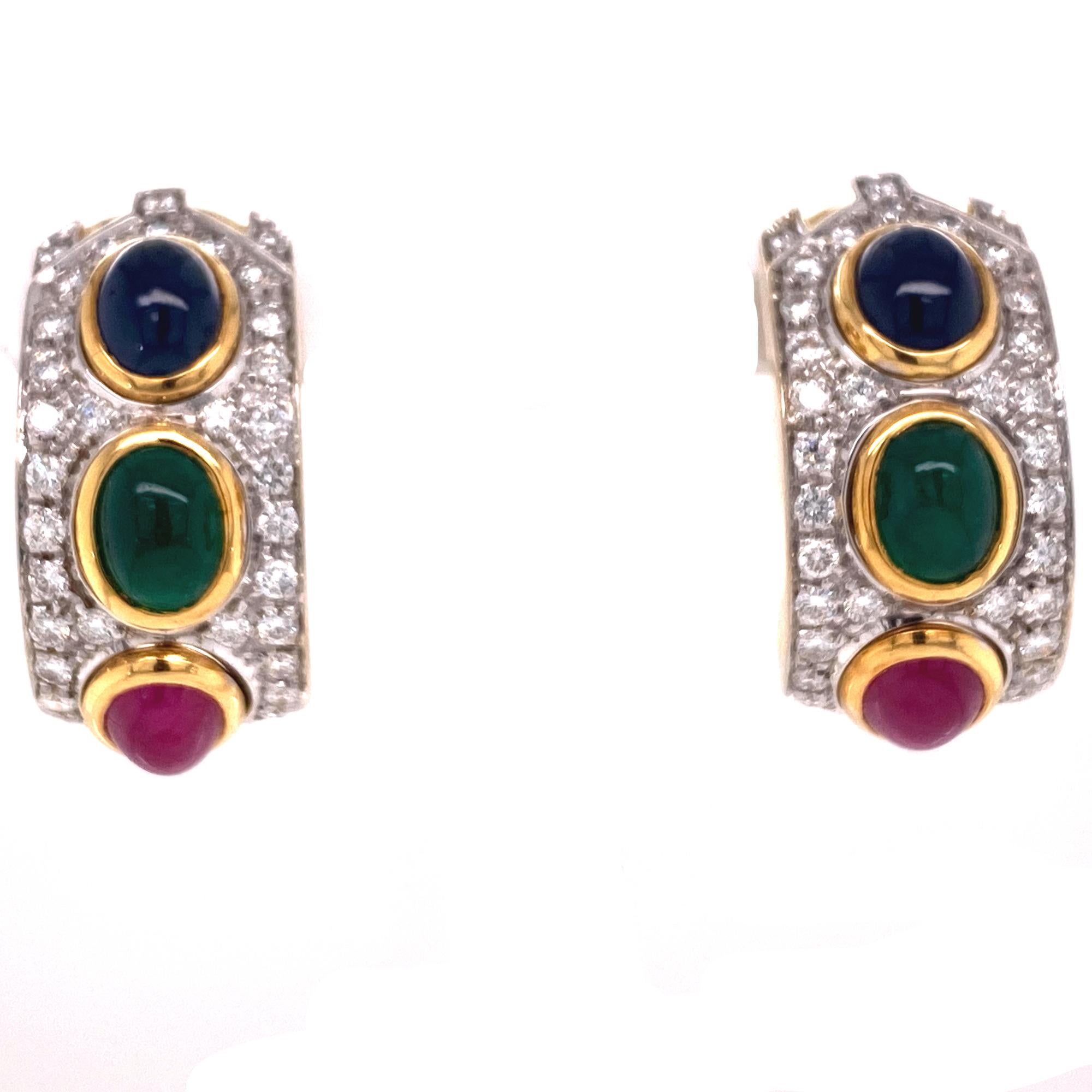 Stunning diamond, sapphire, emerald, and ruby earrings crafted in 18 karat yellow and white gold. These 1960's earrings feature 2.00 CTW round brilliant cut diamonds graded F-G/VS. Cabochon emerald, sapphire, and ruby are set down the center. The