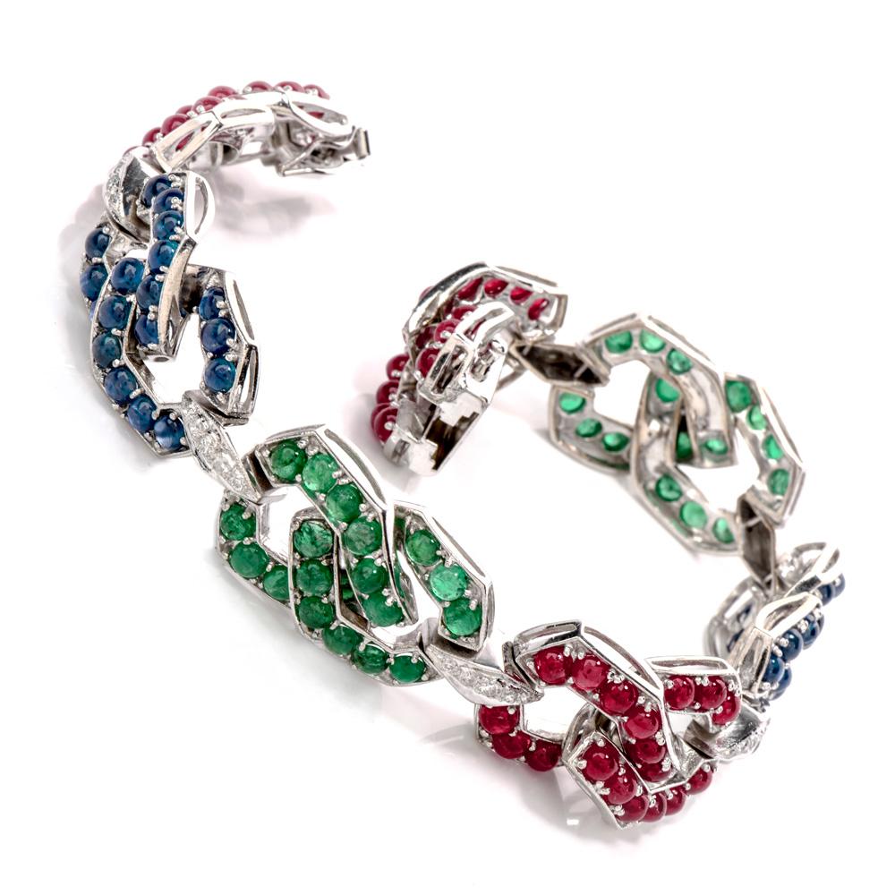 Wear all the “Big 3” infamous gemstones at once, with this Estate Diamond Sapphire Emerald & Ruby 18K Gold link Bracelet!  This bracelet is crafted in 18 karat white gold and displays a chain link design.  There are round cabochons, prong set of