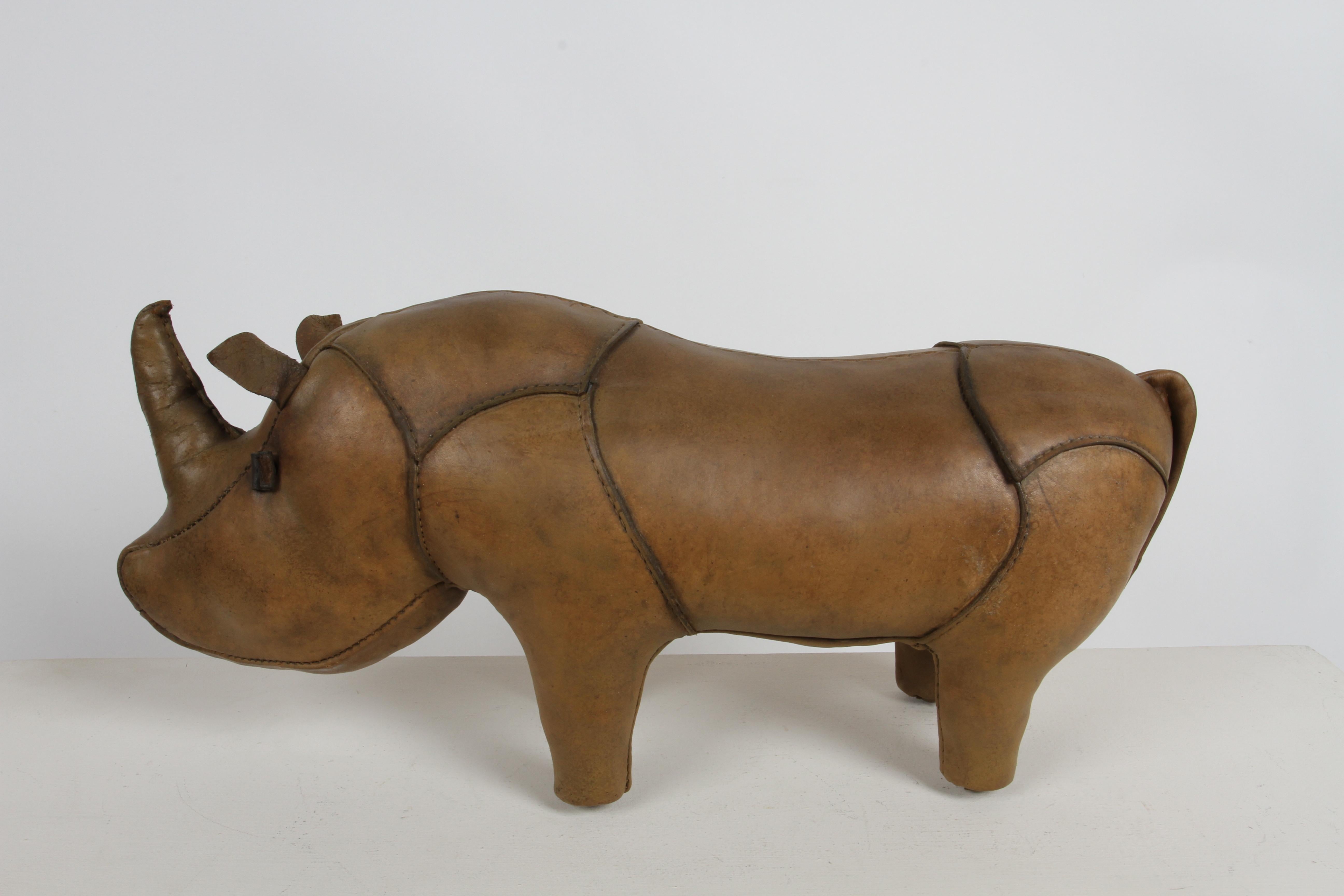 Early Vintage 1960s leather ottoman / sculpture in form of Rhino, made by Omersa and was retailed by Abercrombie & Fitch. This rhino has been refurbished, including new Omersa factory replacement tail, which is very common. Work done by the leading