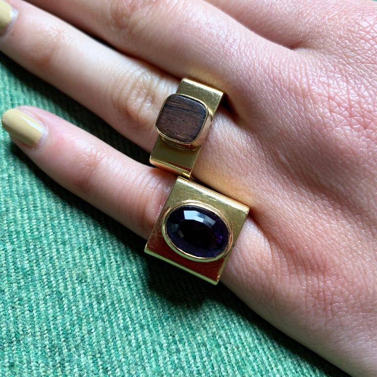 A wood and 18 karat gold ring, by Dinh Van for Cartier, 1960s. The ring is a size 7.5. It is signed Cartier, c (copyright), Dinh Van, 18k and measures 0.3