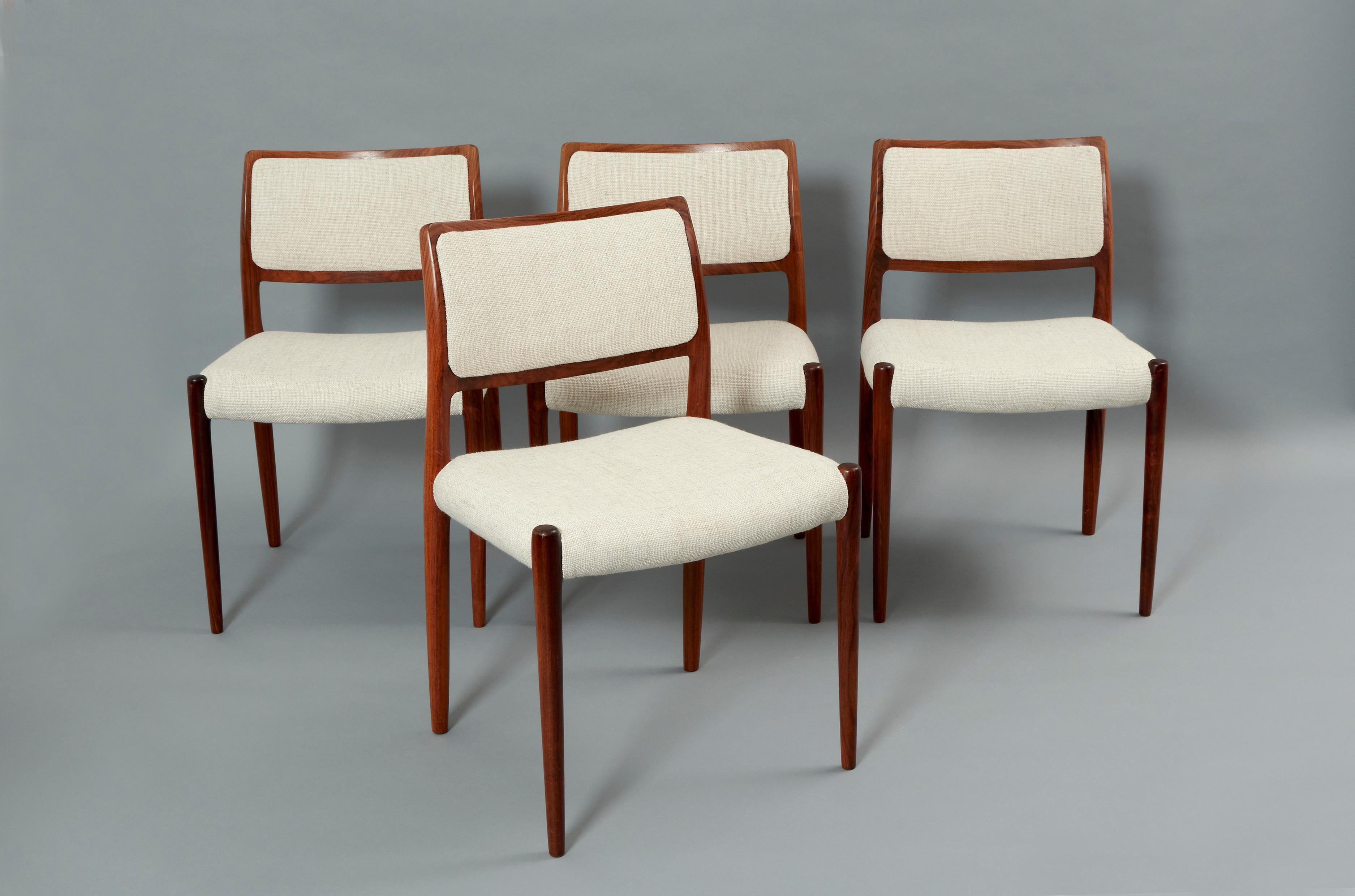 Six Dining room chairs designed by Niels Otto moller for JL Möllers Möbelfabrik. Upholstery and Rosewood. Denmark, 1960s 

Niels O. Moller founded the company J.L. Mollers Mobelfabrik, which produces up to today. He was famous for his chairs, each