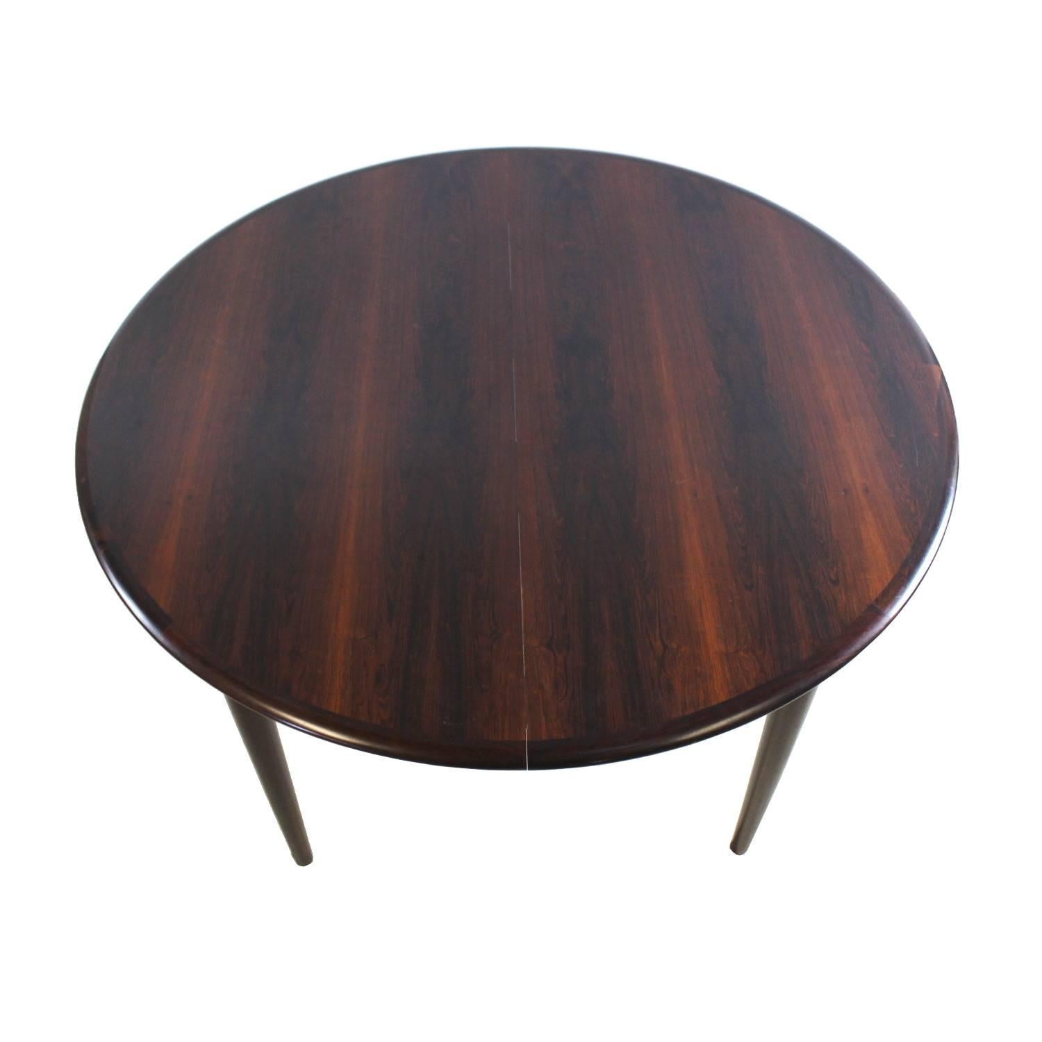 Scandinavian dining table manufactured by Skovmand and Andersen in the 1960s in Denmark. The table is made from mahogany and can seat four, six or eight people by using two extra leaves that would extend the table to a maximum size of 220cm.

  