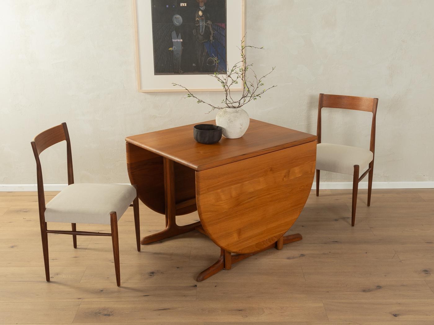 Classic extendable dining table from the 1960s in Scandinavian design. High-quality solid teak frame and table top with two extension leaves.

Quality Features:

    very good workmanship
    high-quality materials
    Made in Denmark, manufacturer: