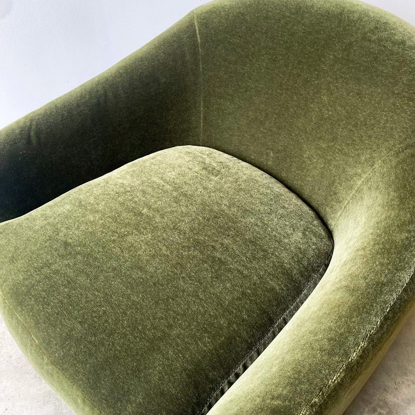 A stunning vintage pair of Directional swivel/rocker lounge chairs.  Newly upholstered in mohair.  
A fantastic pair with a simple and sleek silhouette that offer great comfort in a small footprint.  


