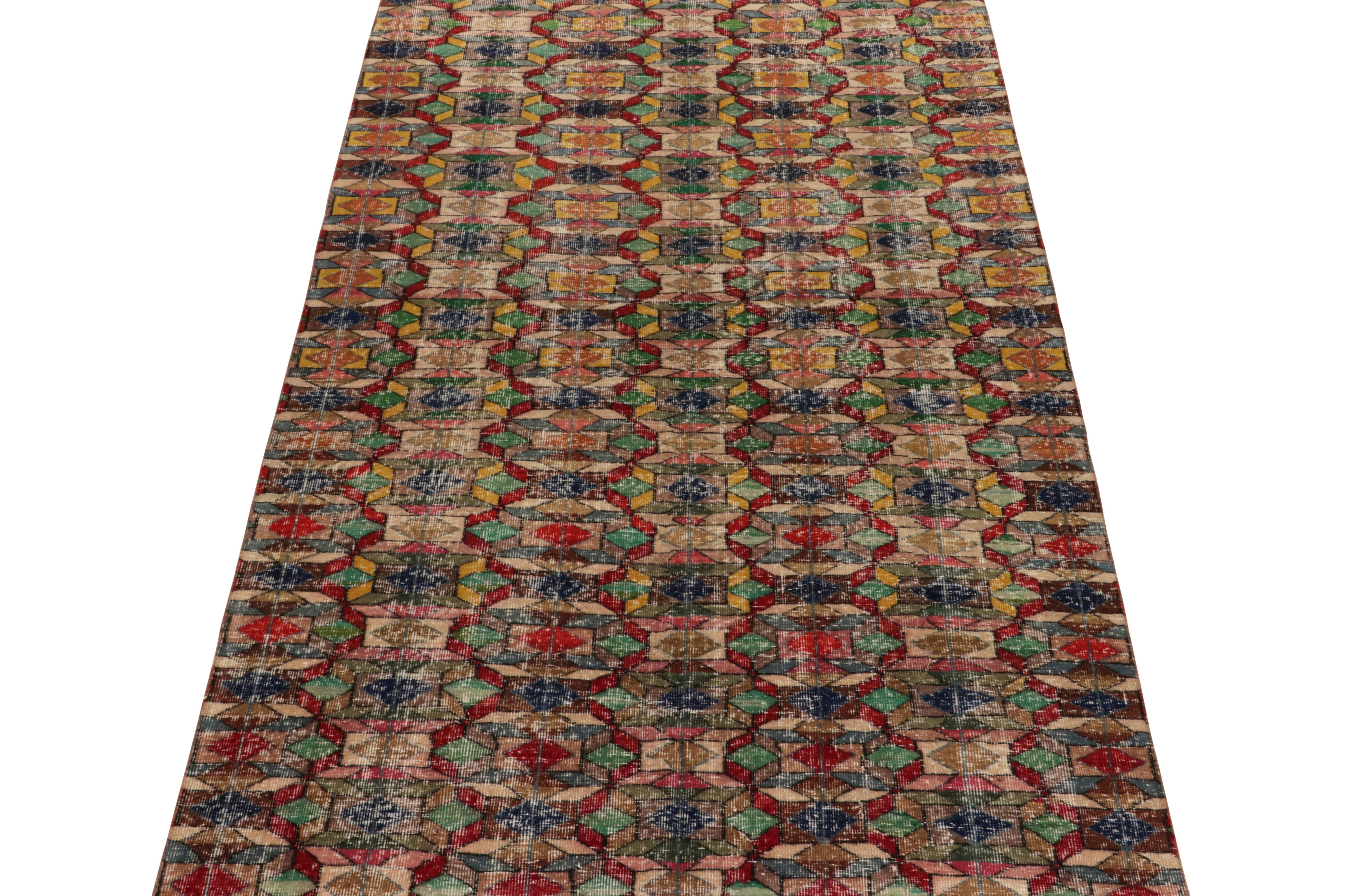 A 6x9 vintage rug from the works of a coveted multidisciplinary Turkish designer, among the latest to join Rug & Kilim’s curated Mid-Century Pasha collection. 

A gorgeous interplay of grass green, ink blue, beige/brown & red complements the