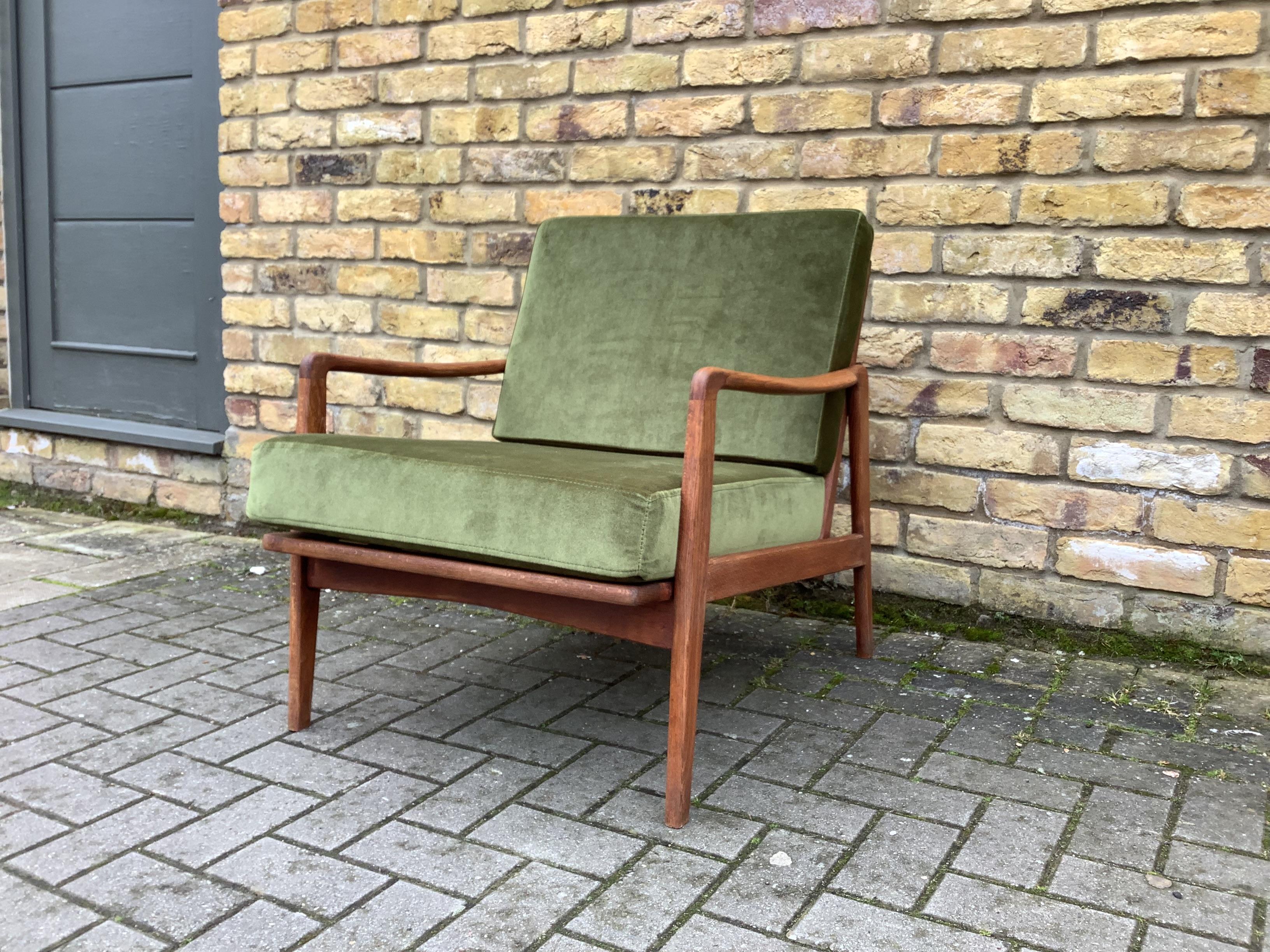 1960;s Danish armchair reupholstered cushions and new webbing
makes for a comfortable armchair with a classic 60's mid century modern
Scandinavian design